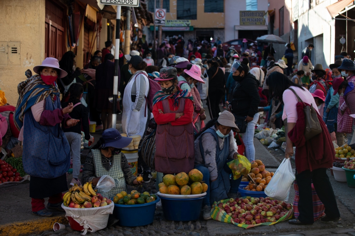 Vendors wear protective masks at a market in Cusco, Peru, on Oct. 13, 2020. MUST CREDIT: Bloomberg photo by Jonne Angela Ponce