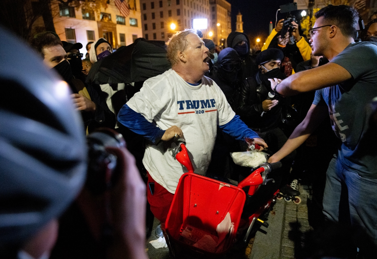 A Trump supporter is forced out of Black Lives Matter Plaza by demonstrators on Nov. 14 in Washington D.C. MUST CREDIT: Photo for The Washington Post by Evelyn Hockstein
