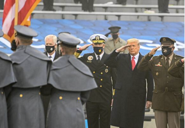 President Donald Trump salutes the flag during the playing of the national anthem prior to the 121st Army-Navy football game at Michie Stadium in New York on Dec. 12, 2020. MUST CREDIT: Washington Post photo by Jonathan Newton