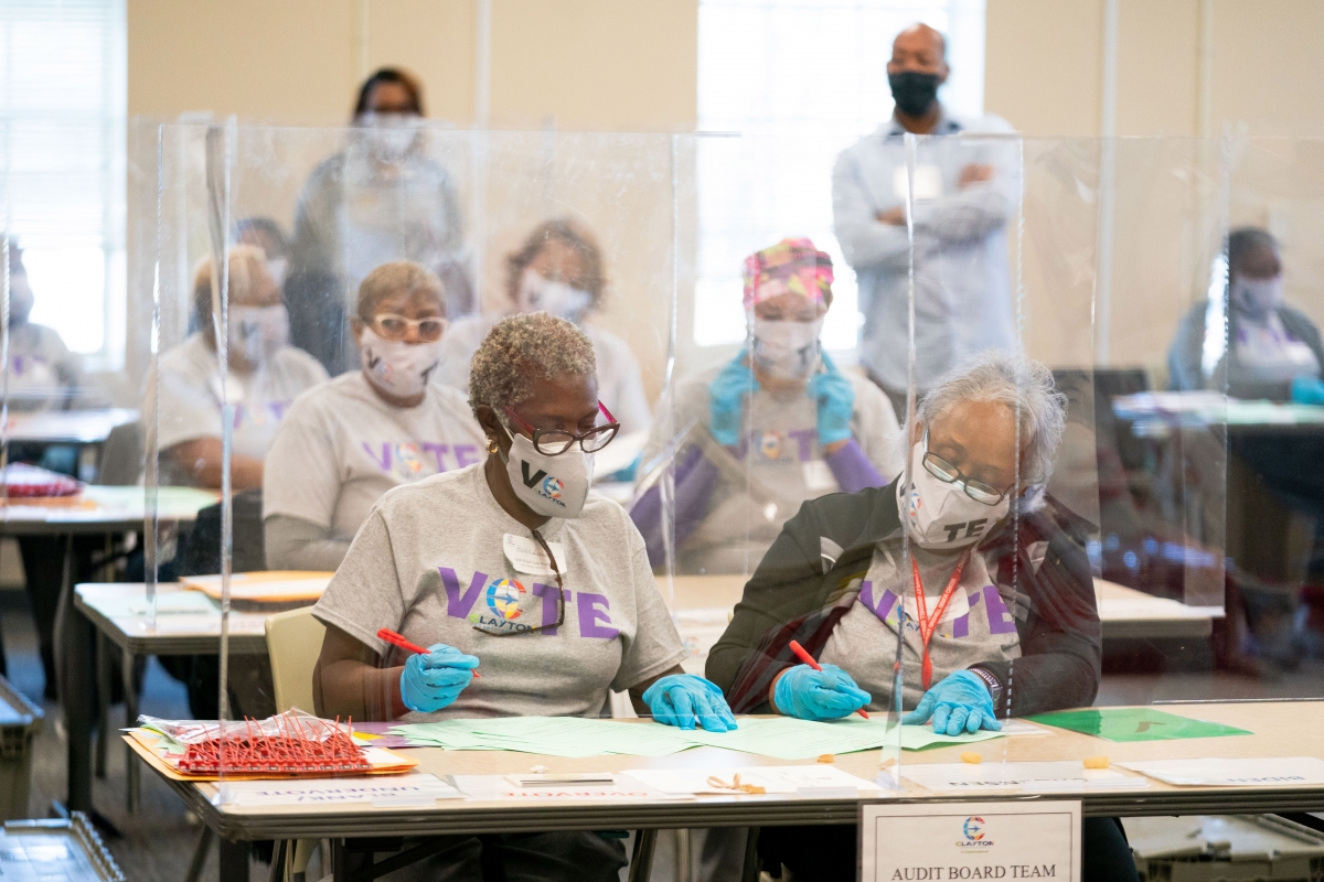 Clayton County, Ga., election workers recount votes by hand on No. 13, 2020. MUST CREDIT: Photo for The Washington Post by Kevin D. Liles