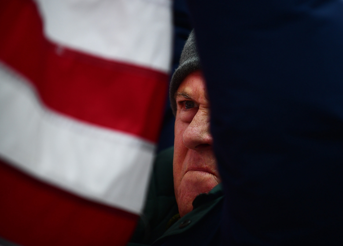 A supporter of President Donald Trump waves his flag while joining fellow supporters at Freedom Plaza to protest the results of the election. MUST CREDIT: Photo by Astrid Riecken for The Washington Post.