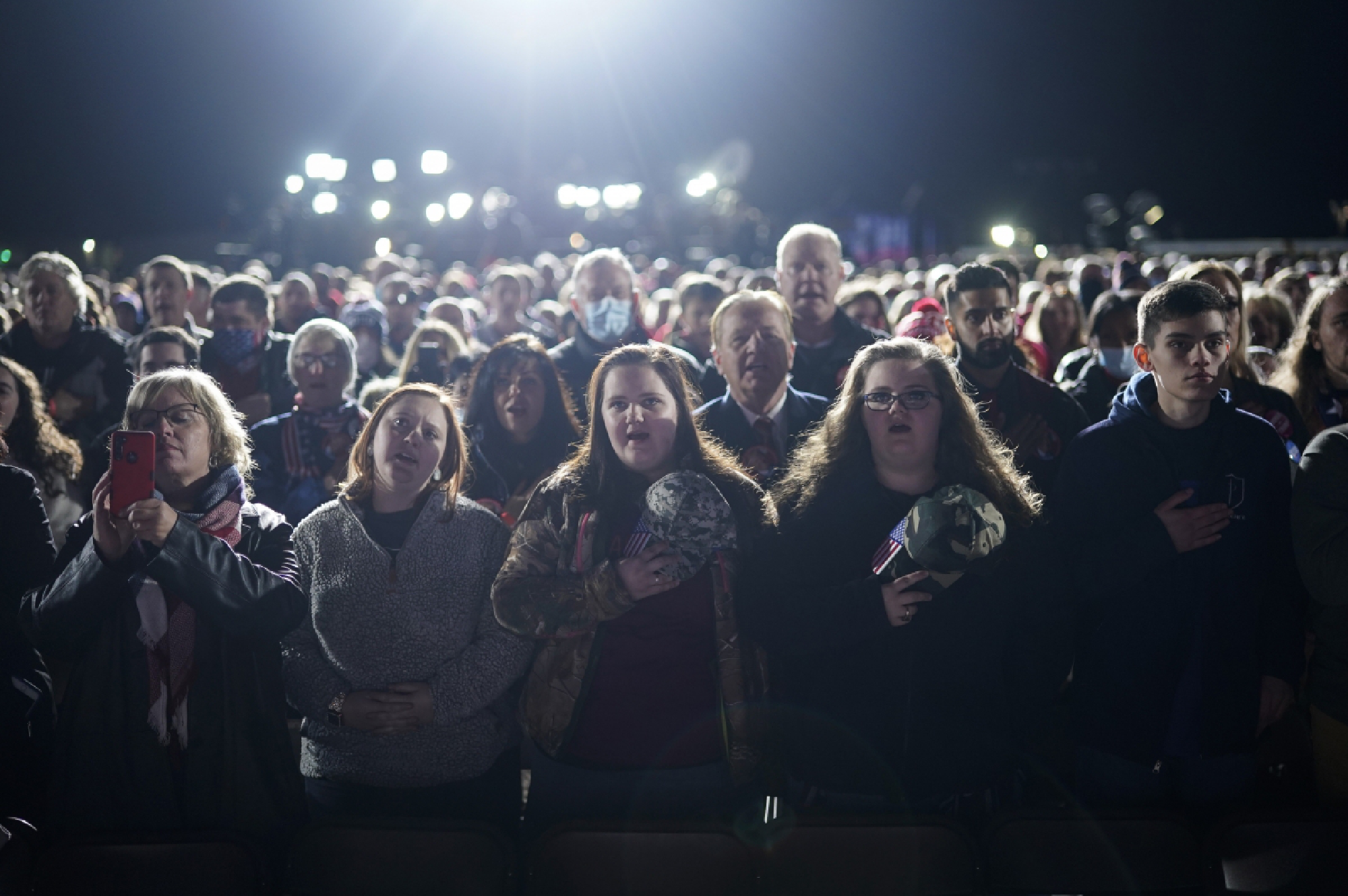 Supporters wait for President Donald Trump at Monday's rally. MUST CREDIT: Washington Post photo by Jabin Botsford