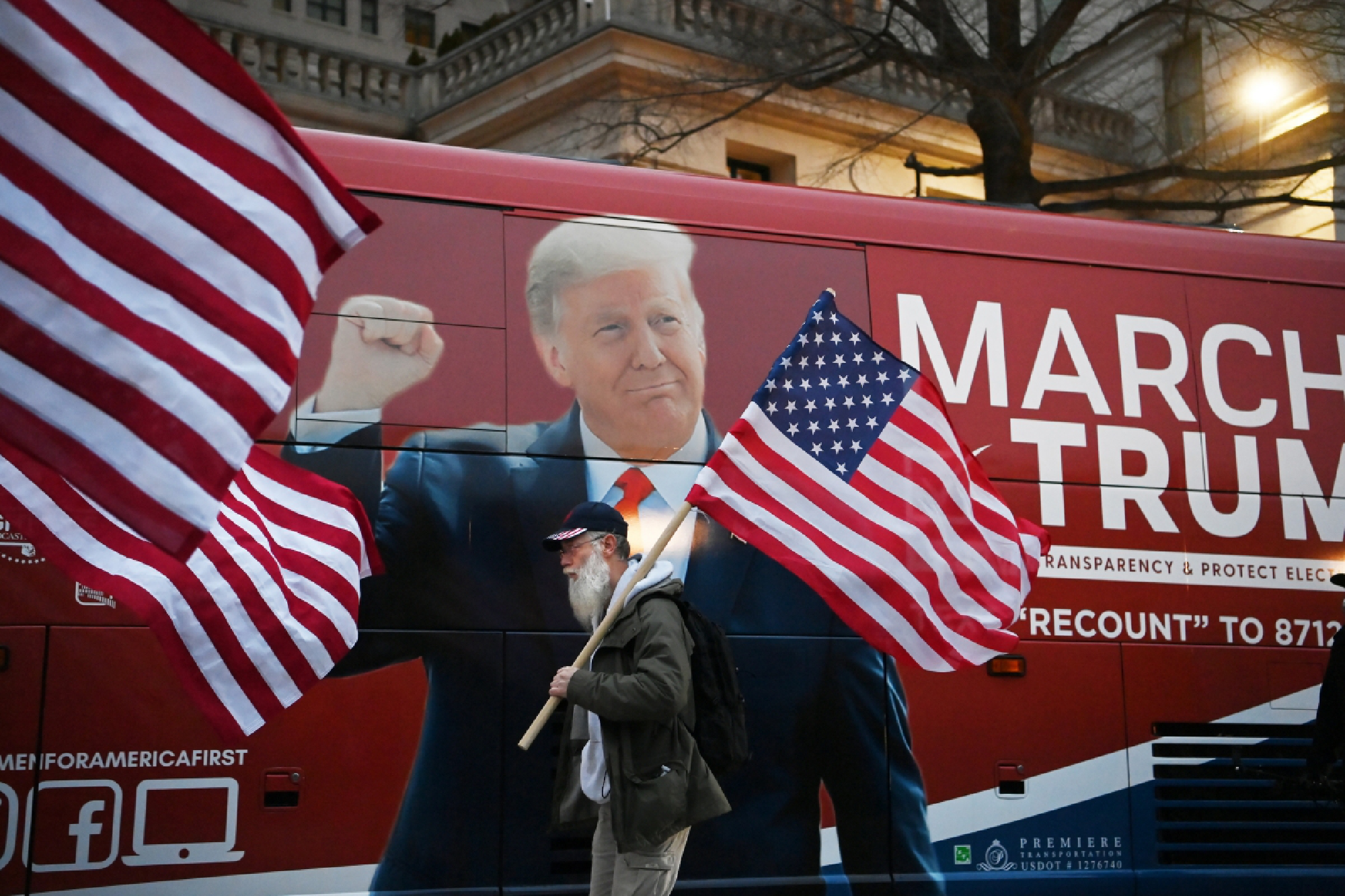 A supporter of President Donald Trump walks near the White House on Wednesday. MUST CREDIT: Washington Post photo by Matt McClain