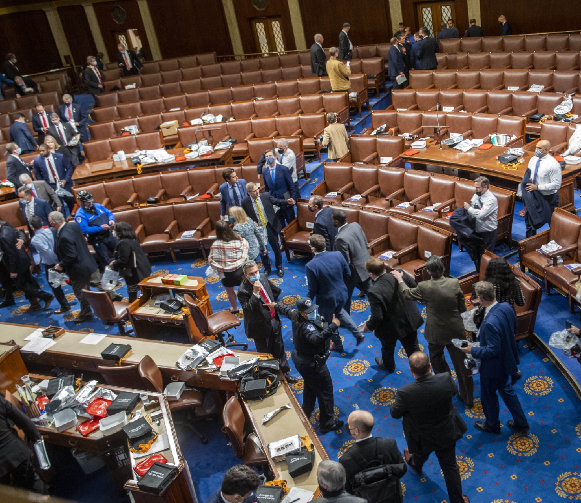 Capitol police direct members and staffers out of the House as a mob of rioters storms the Capitol on Wednesday, Jan. 6, 2021. MUST CREDIT: Washington Post photo by Bill O'Leary