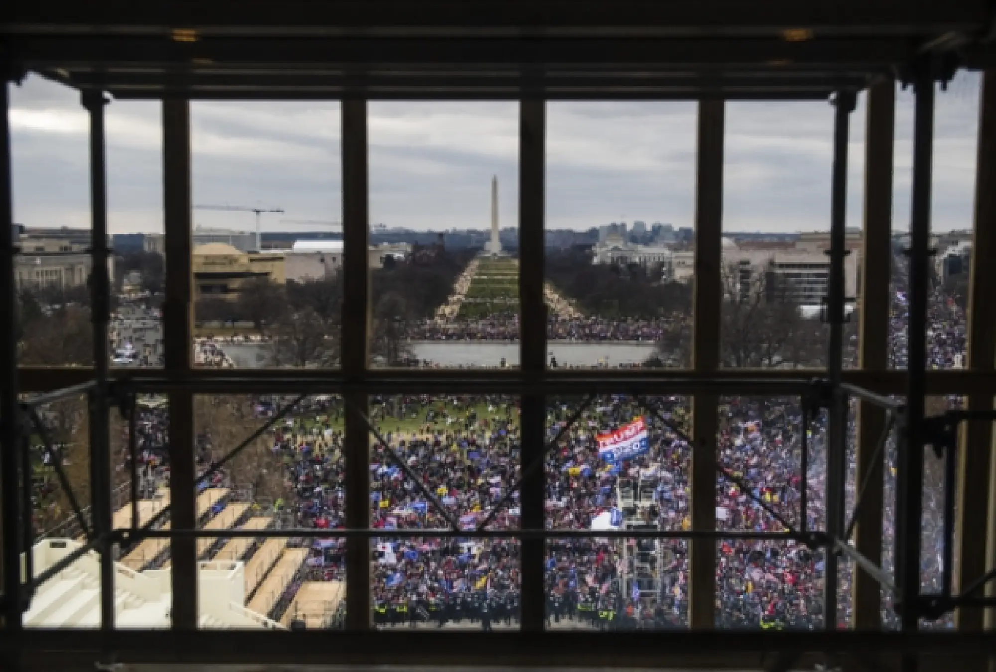 People stand outside the Capitol on Wednesday, Jan. 6, 2021. MUST CREDIT: Photo for The Washington Post by Amanda Voisard