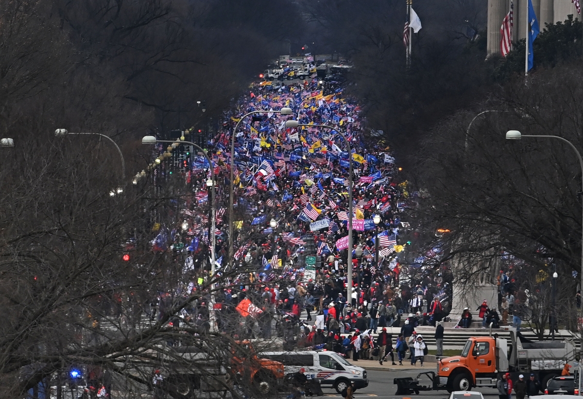 Trump supporters make their way up Constitution Avenue en route to the Capitol after the president gave a speech at the White House Ellipse on Wednesday, Jan. 6, 2021. MUST CREDIT: Washington Post photo by Michael S. Williamson