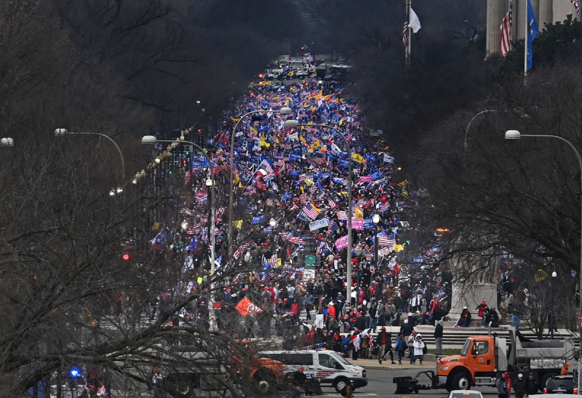 Trump supporters make their way up Constitution Avenue en route to the Capitol after the president gave a speech at the White House Ellipse on Wednesday, Jan. 6, 2021. MUST CREDIT: Washington Post photo by Michael S. Williamson