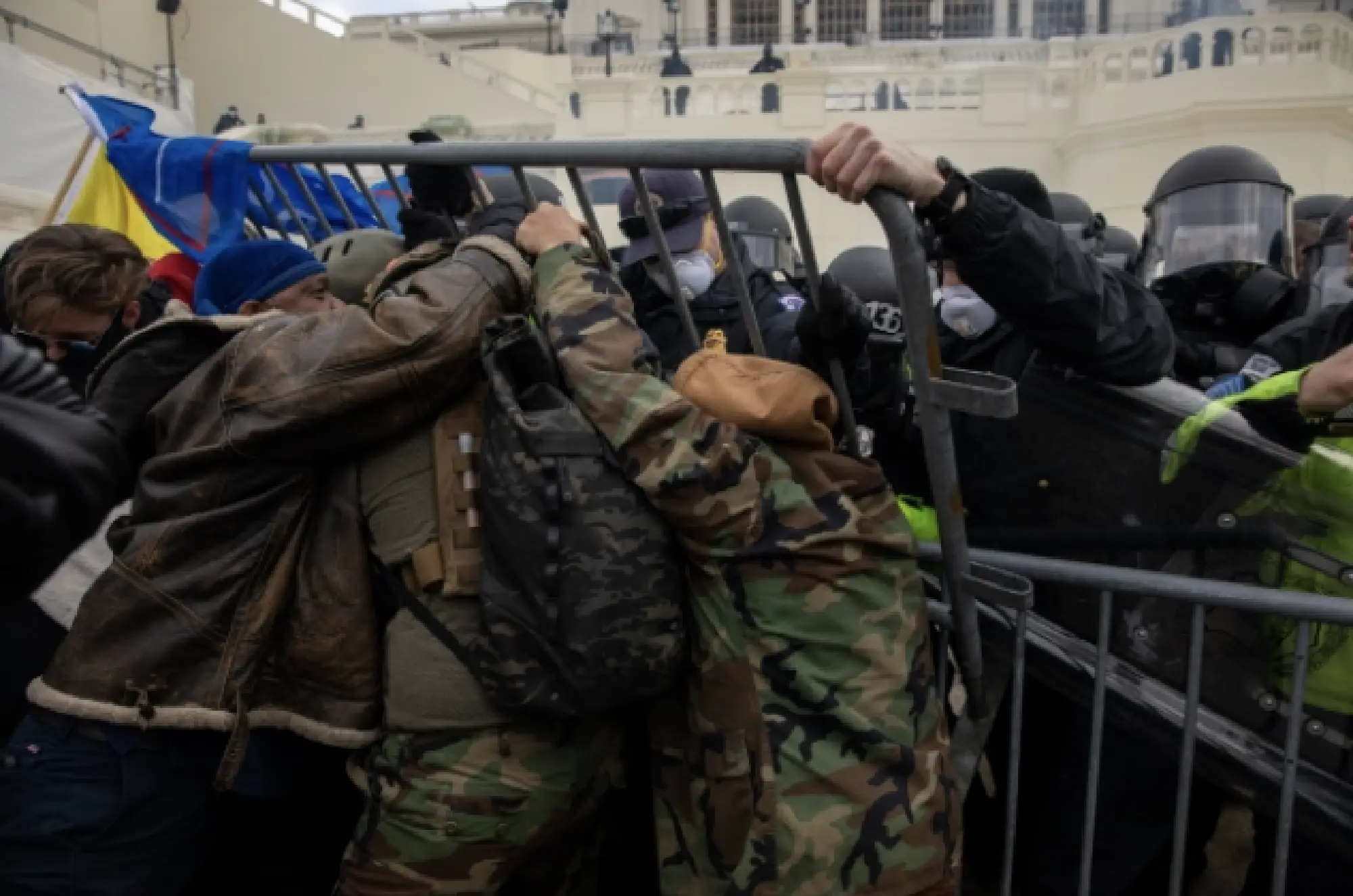 A mob of rioters push into Capitol police on Wednesday, Jan. 6, 2021. MUST CREDIT: Washington Post photo by Michael Robinson Chavez