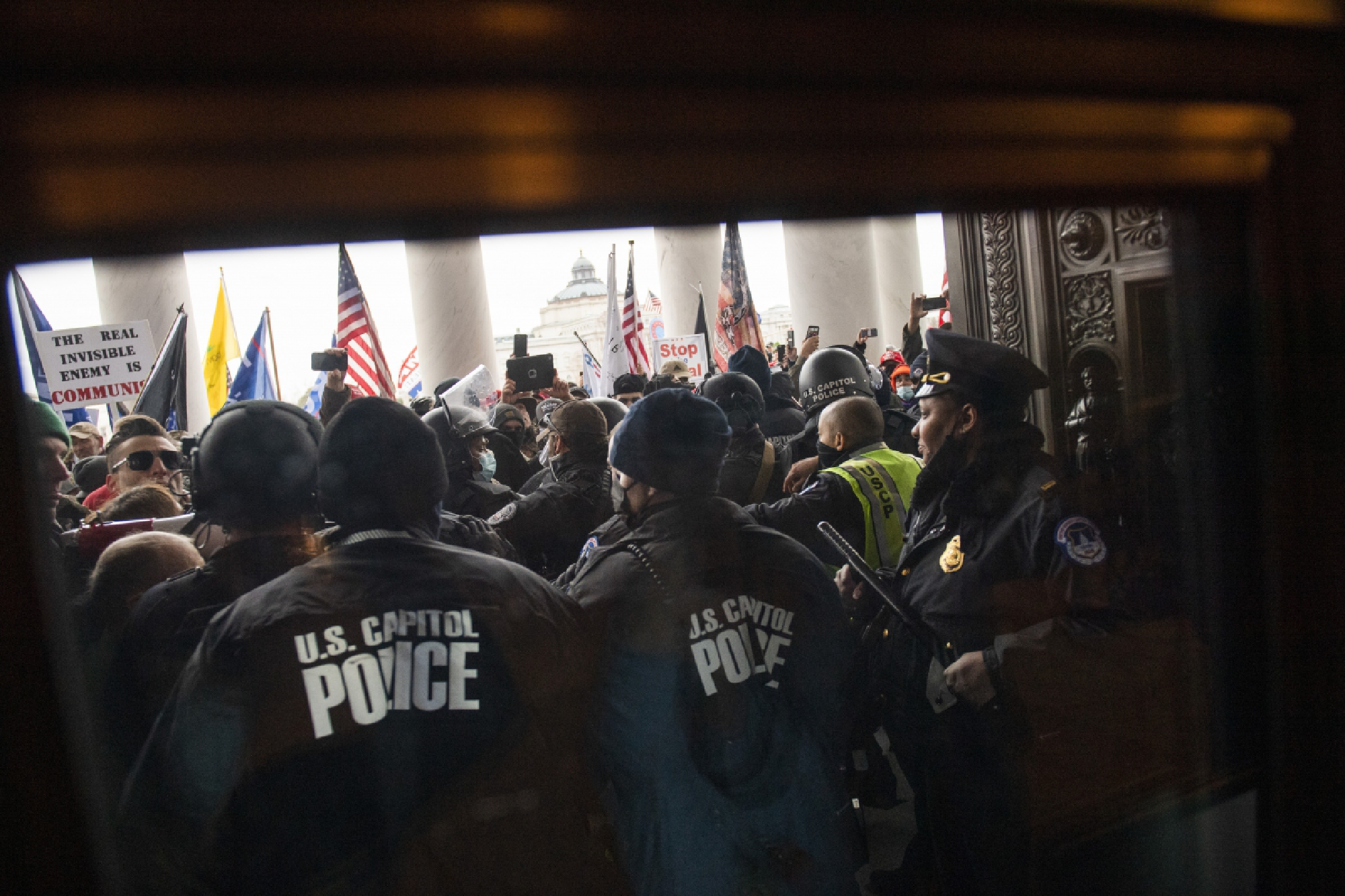 Protesters fight to gain access to the U.S. Capitol during a joint congressional session to certify the electoral college vote in Washington, D.C. on Jan. 6, 2021. MUST CREDIT: Photo for The Washington Post by Amanda Voisard