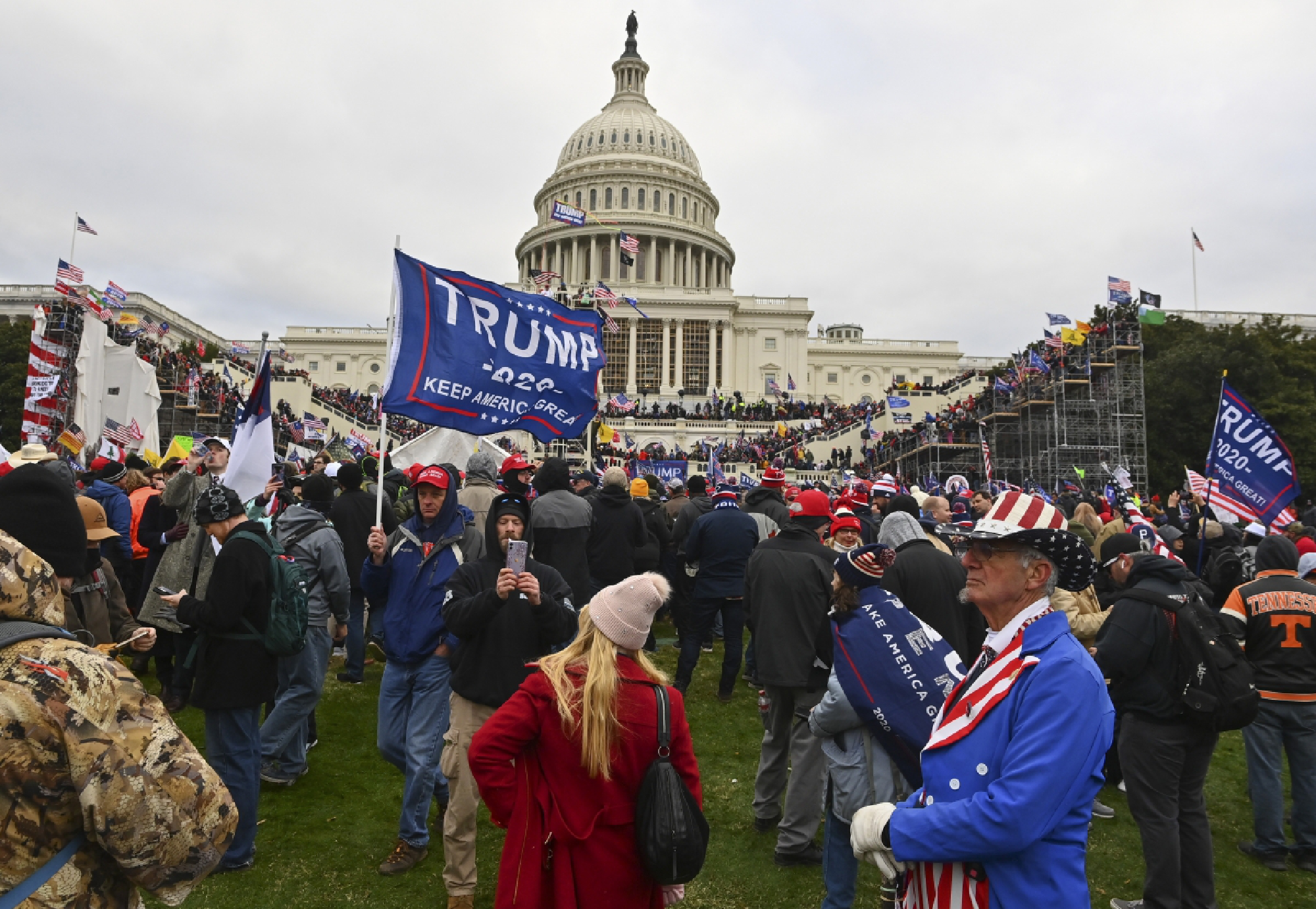Protesters take over the Inaugural stage during a protest calling for legislators to overturn the election results in President Donald Trump's favor at the U.S. Capitol on Jan. 6, 2021, in Washington, D.C. MUST CREDIT: Washington Post photo by Ricky Carioti