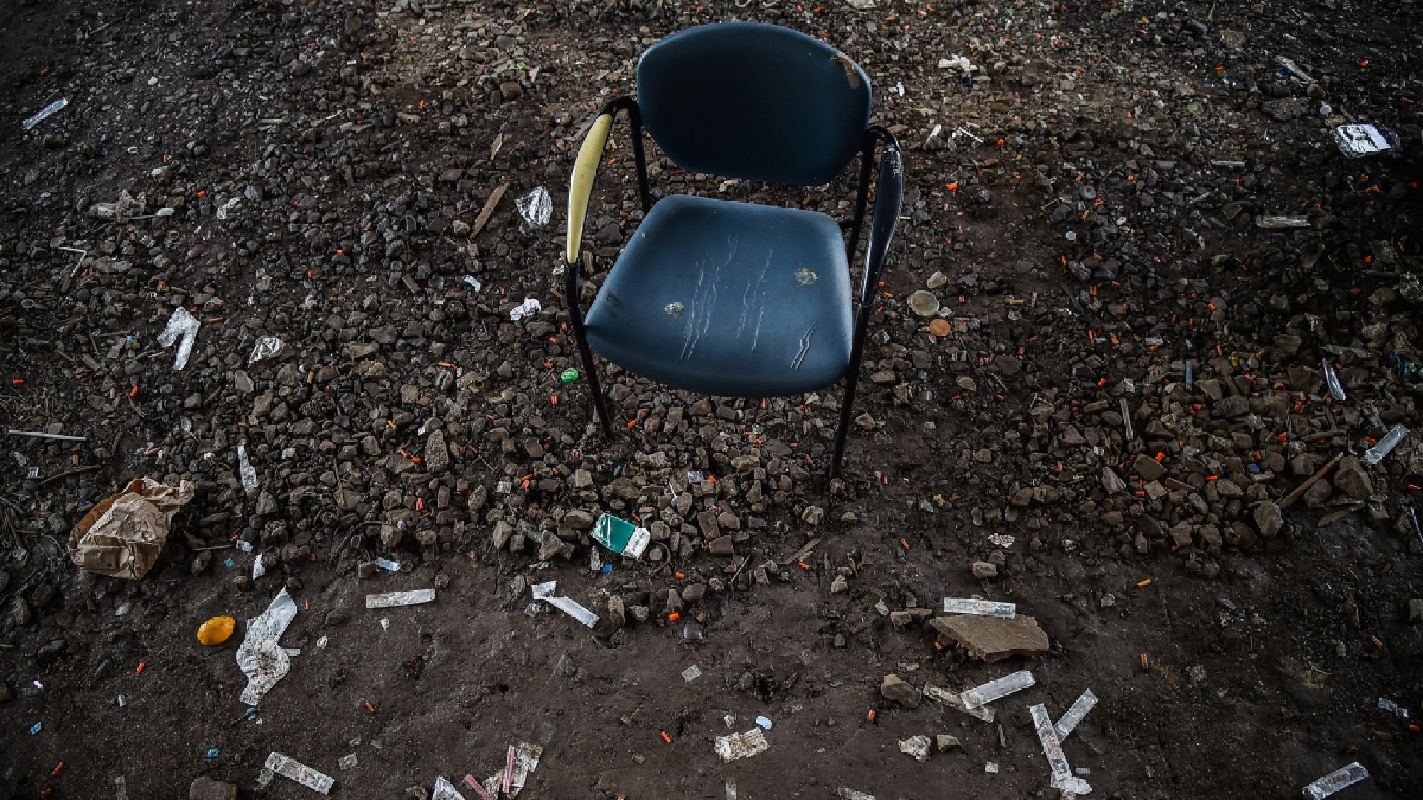 A chair used by people while they do drugs sits under a bridge near train tracks in Philadelphia on July 27. MUST CREDIT: Washington Post photo by Salwan Georges.