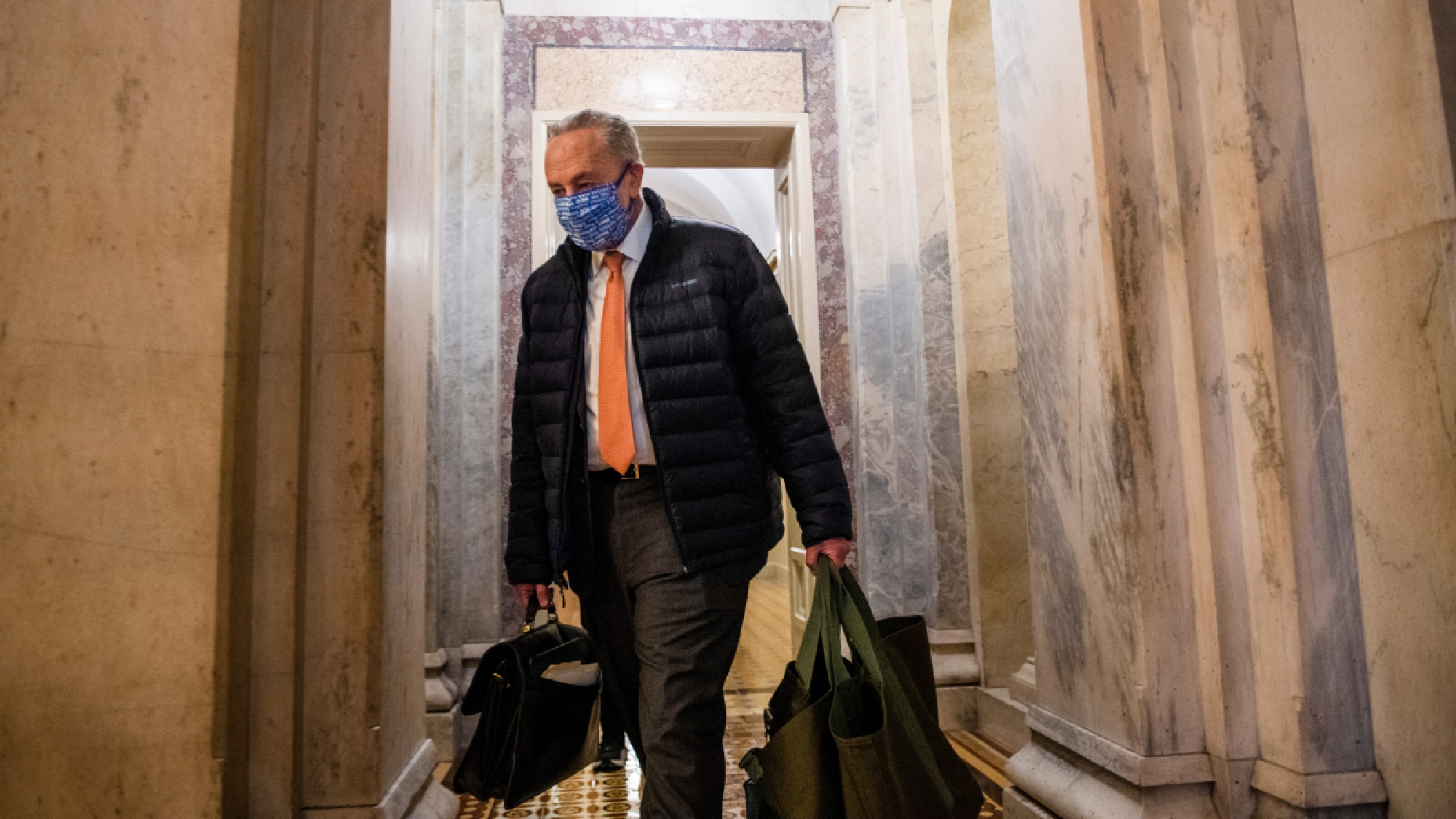 Senate Minority Leader Chuck Schumer, D-N.Y., who will become majority leader now that Democrats have won control of the Senate, leaves the Capitol after a vote on Jan. 1. MUST CREDIT: photo for The Washington Post by Amanda Voisard.