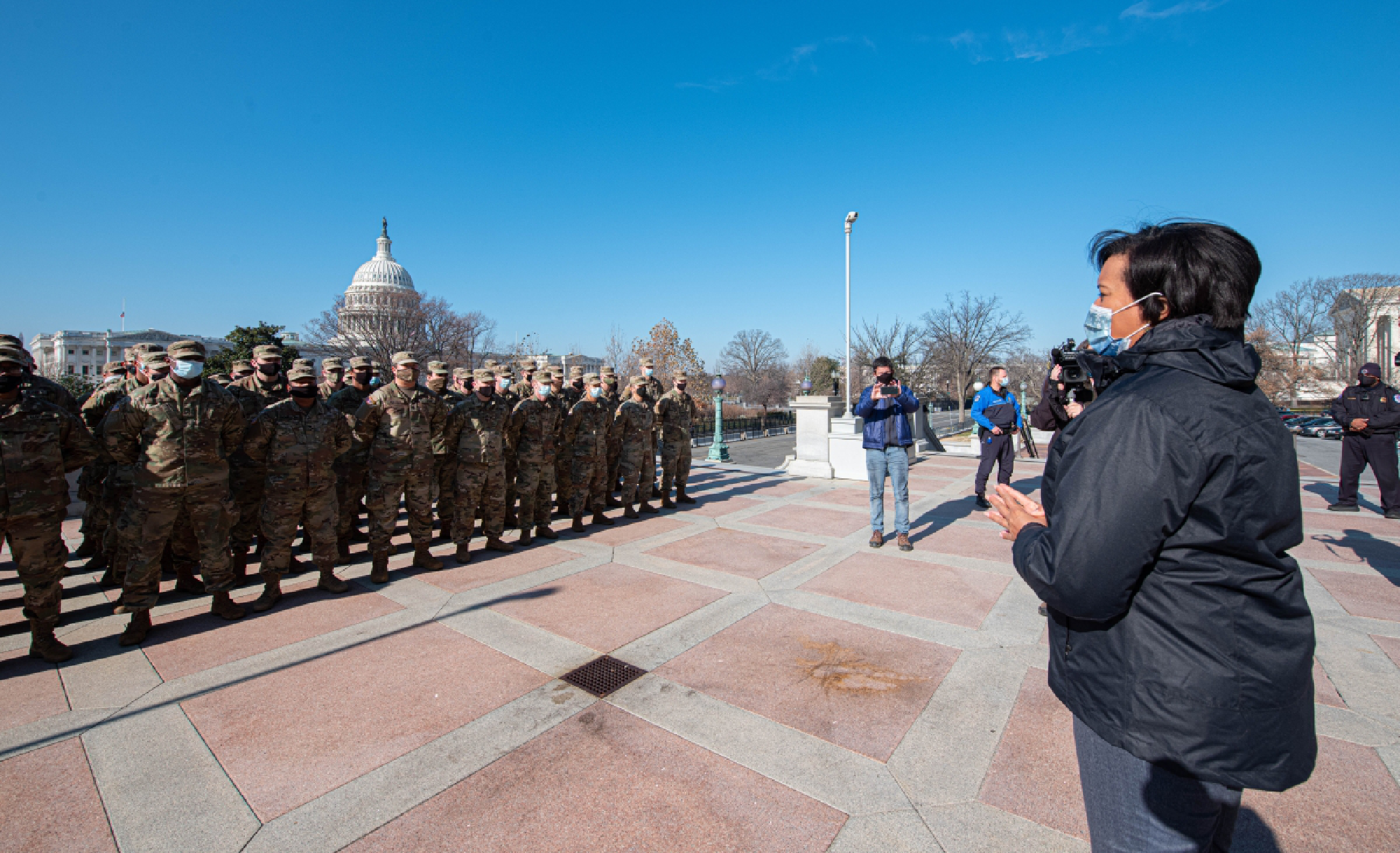 D.C. Mayor Muriel Bowser, a Democrat, approaches Virginia National Guard troops guarding the Capitol on Tuesday, Jan. 12, 2021. MUST CREDIT: Executive Office of Mayor Muriel Bowser photo by Khalid Naji-Allah