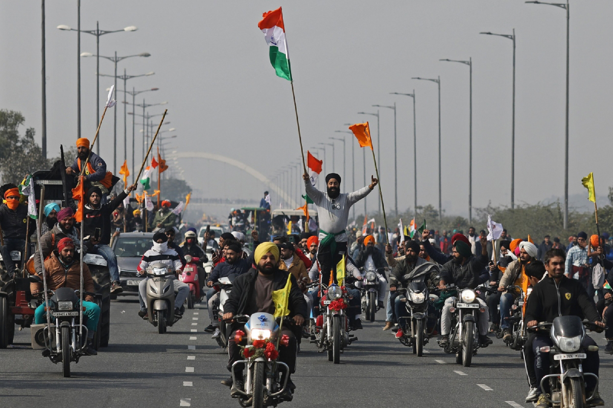 Farmers travel along the Inner Ring Road in New Delhi in January 2021. Bloomberg photo by Anindito Mukherjee