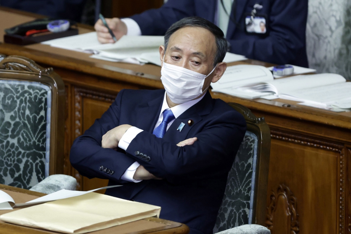 Prime Minister Yoshihide Suga attends an ordinary session at the lower house of parliament on Jan. 18. MUST CREDIT: Bloomberg photo by Kiyoshi Ota.