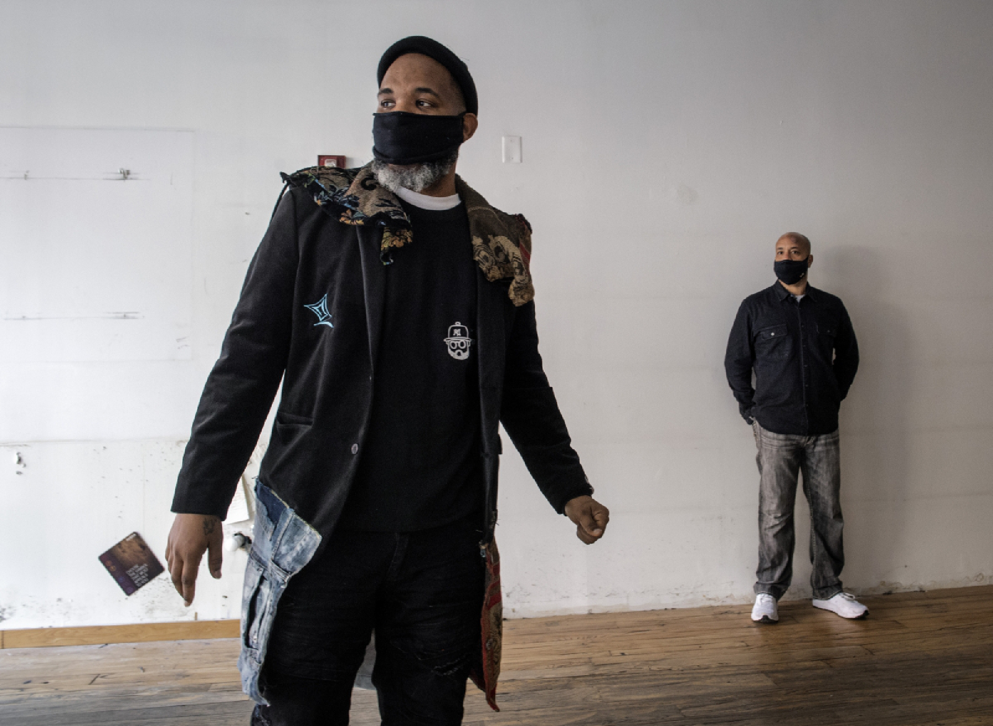 Artist Demont Pinder, left, and PAINTS Institute Executive Director John Chisholm examine the space inside the former Aveda Institute. MUST CREDIT: Washington Post photo by Bill O'Leary