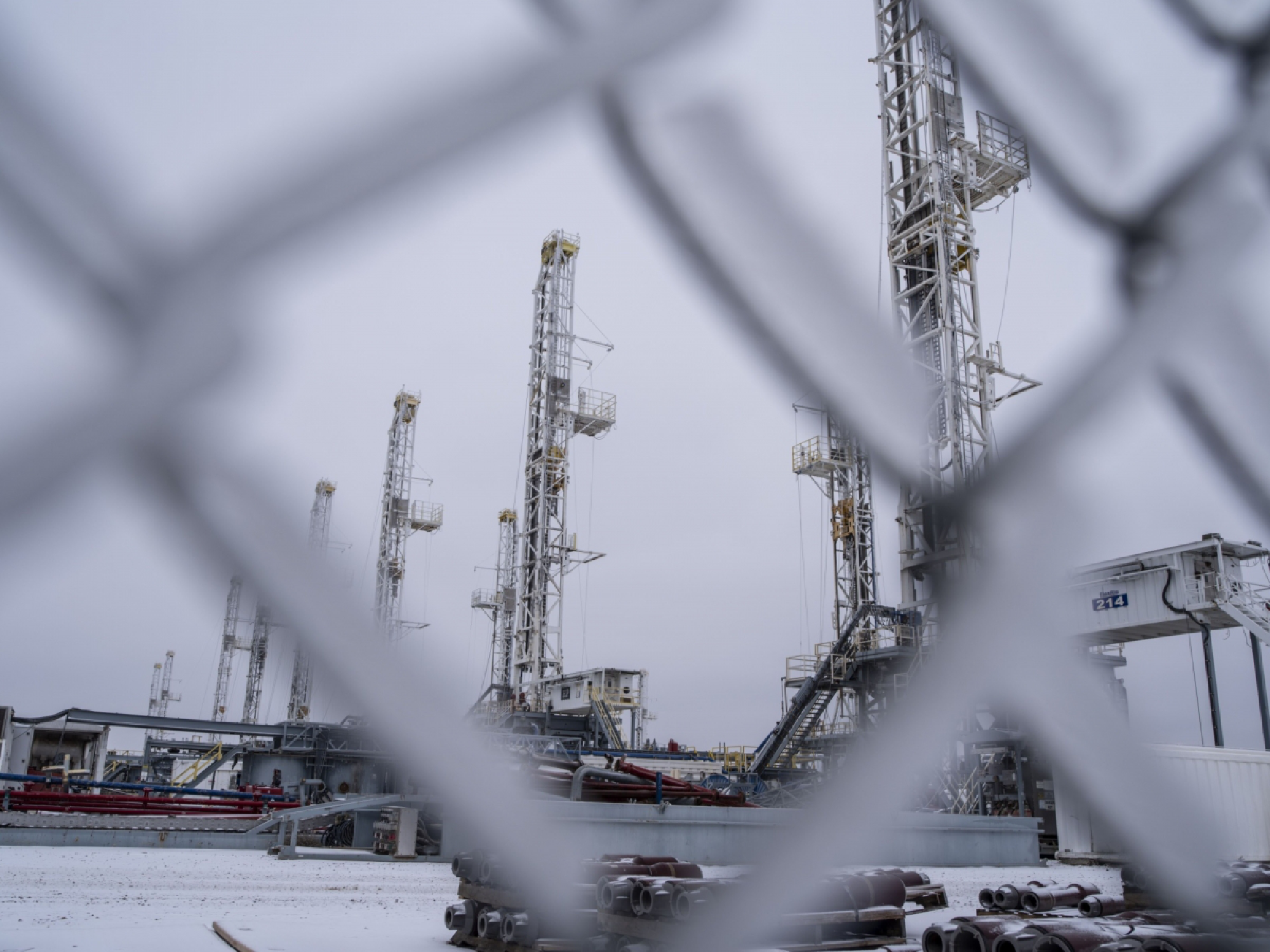 Idle oil drilling rigs in the snow at a lot near Midland, Texas,on Feb. 13, 2021. MUST CREDIT: Bloomberg photo by Matthew Busch