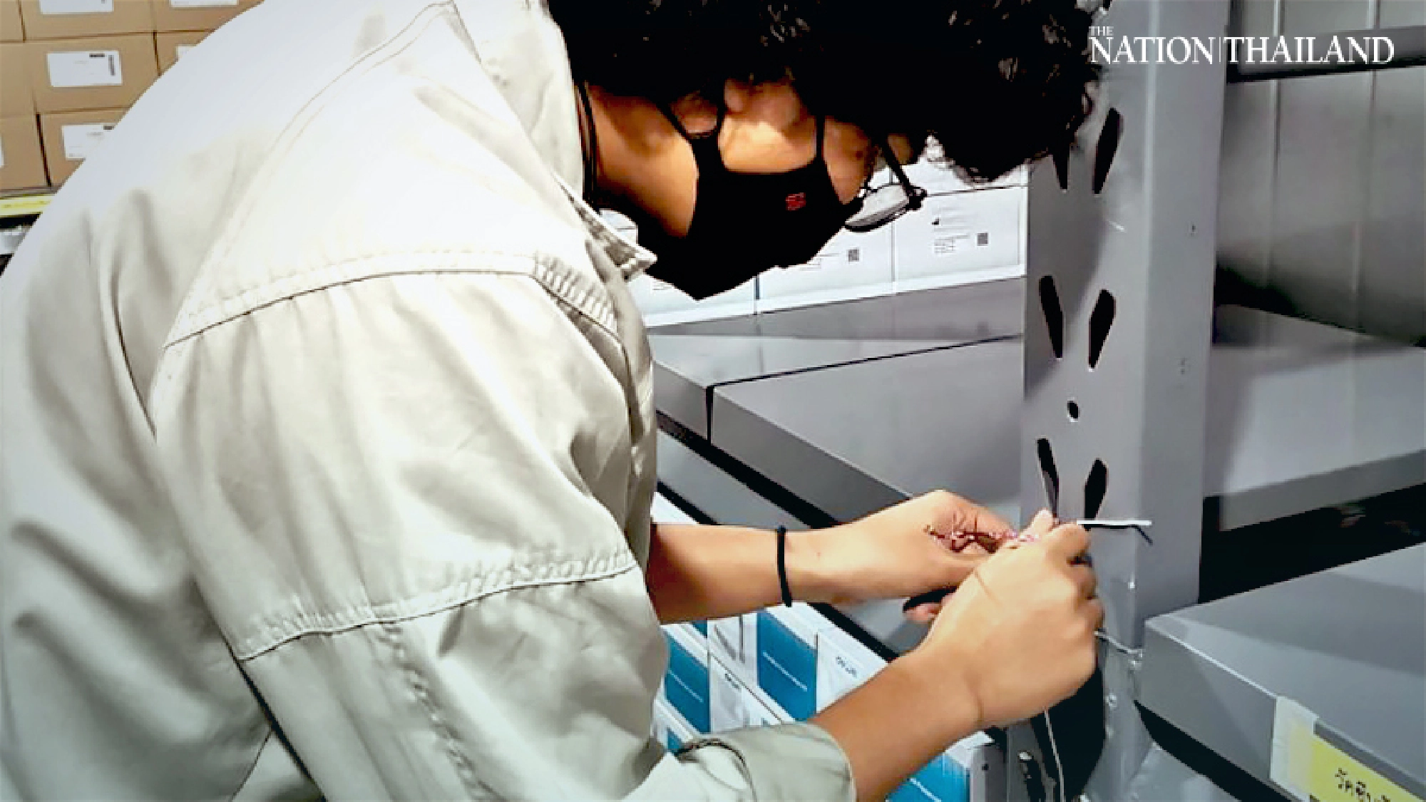 Specialists check to see if warehouse cool enough to store vaccine