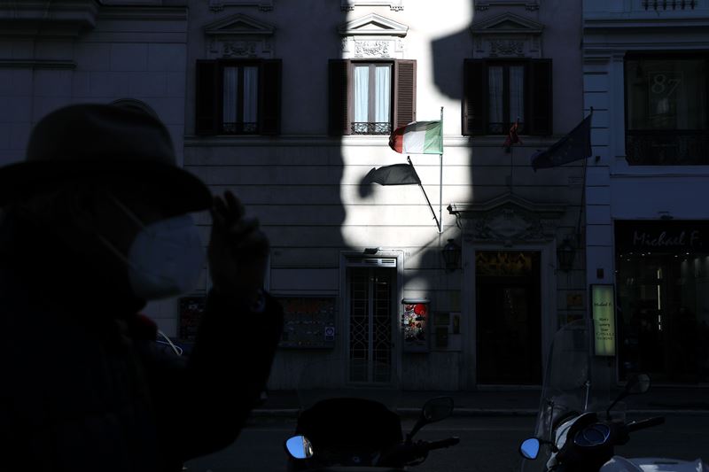 The Italian national flag flies outside a shop in Rome on Jan. 26, 2021. MUST CREDIT: Bloomberg photo by Alessia Pierdomenico.