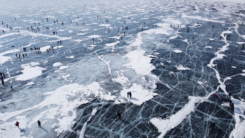 Weekends draw throngs of visitors to the clear ice of Russia's Lake Baikal. MUST CREDIT: Photo for The Washington Post by Elena Anosova