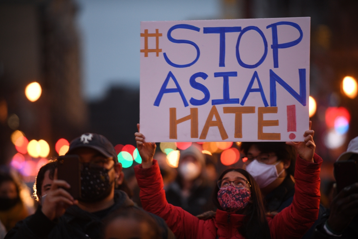 A vigil and march to remember and honor the eight lives lost Tuesday in Atlanta, Ga., takes place in the Chinatown area of the District of Columbia on Wednesday, March 17, 2021. Photo by Astrid Riecken for The Washington Post