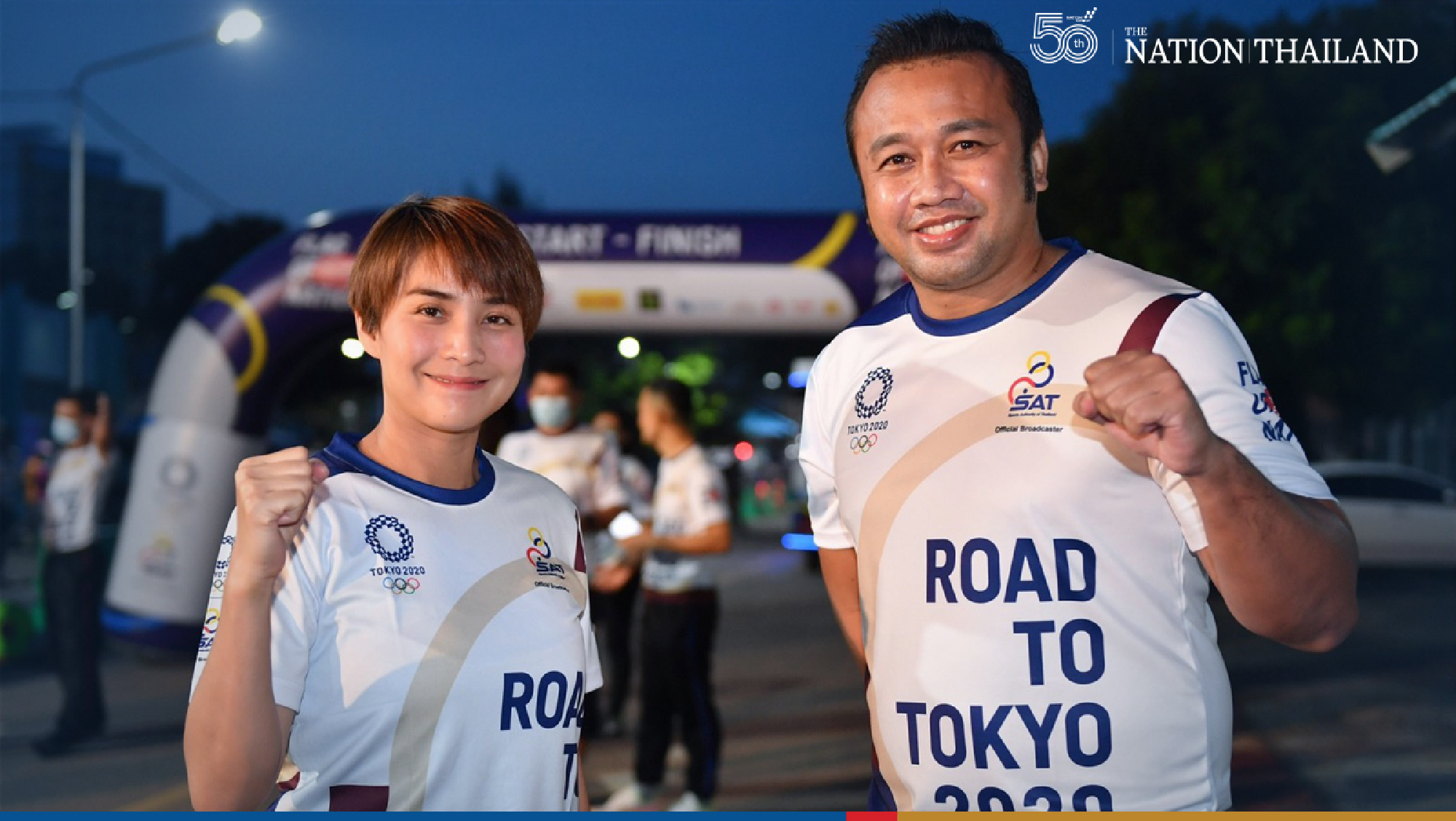 Two former Olympic athletes, Yaowapa Boorapolchai and Manus Boonjumnong, joined the “Flag of Nation” relay on Thursday as the nationwide run reached its 26th day.