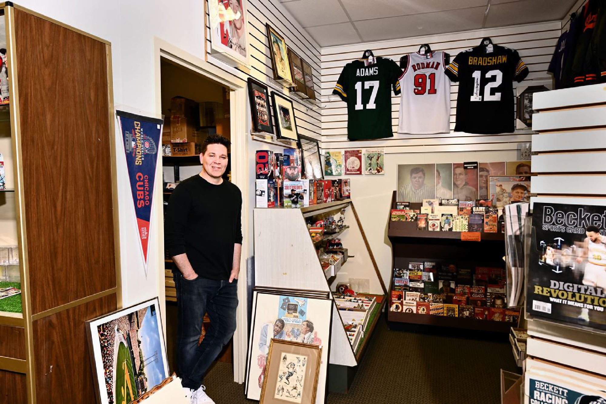 Bryan Theis, who runs the House of Cards shop in Silver Spring. The store has seen an uptick in trading card sales. MUST CREDIT: Washingon Pos photo by Marvin Joseph