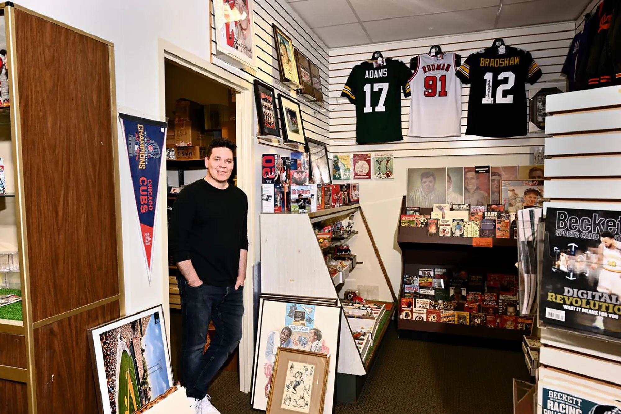 Bryan Theis, who runs the House of Cards shop in Silver Spring. The store has seen an uptick in trading card sales. MUST CREDIT: Washingon Pos photo by Marvin Joseph