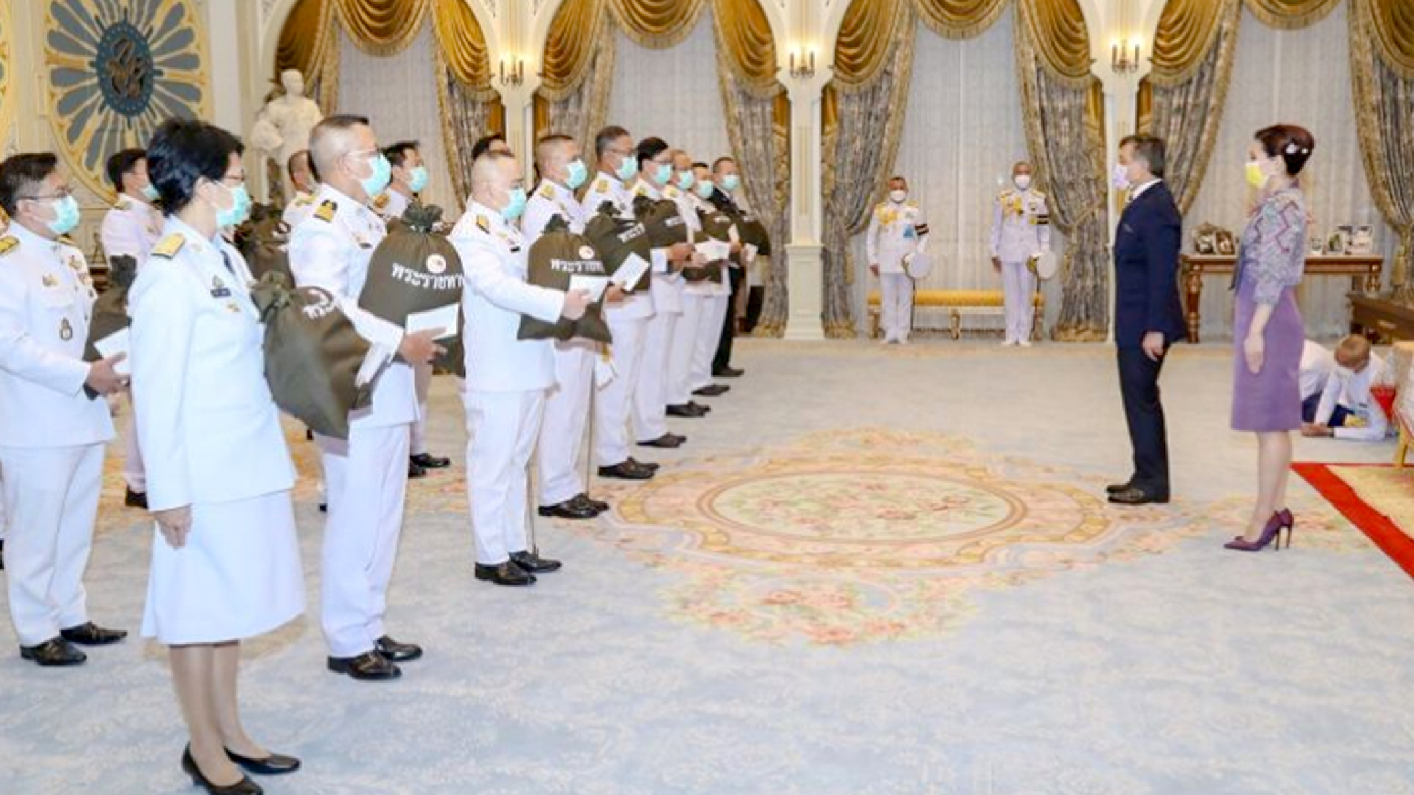 Their Majesties present support bags to hospital staff to mark Queens birthday