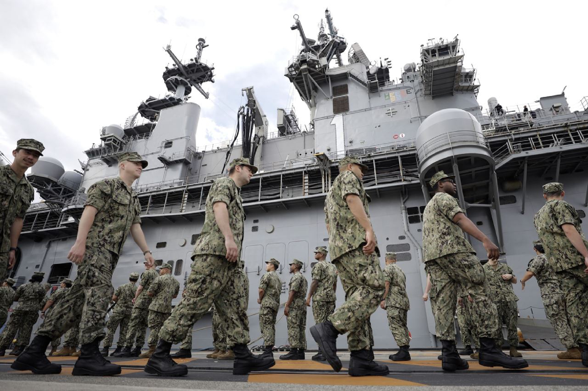 U.S. military personnel gather to board the USS Wasp aircraft carrier ahead of the Memorial Day address by President Trump at the U.S. naval base in Yokosuka, Kanagawa Prefecture, Japan, on May 28, 2019. MUST CREDIT: Bloomberg photo by Kiyoshi Ota.