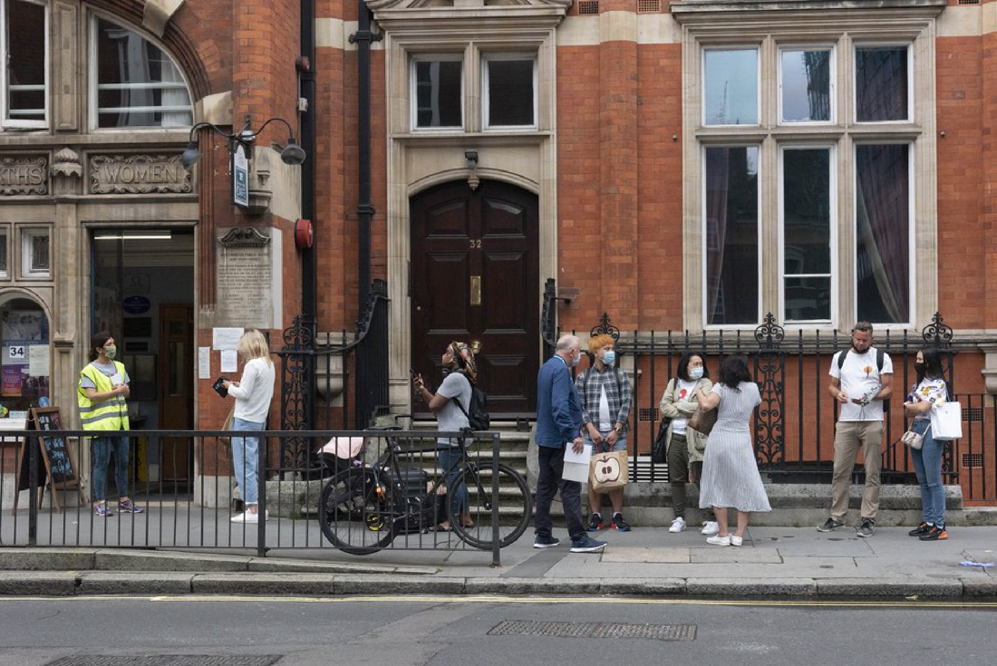 COVID vaccine walk-in centers open across England amid resurge of cases.