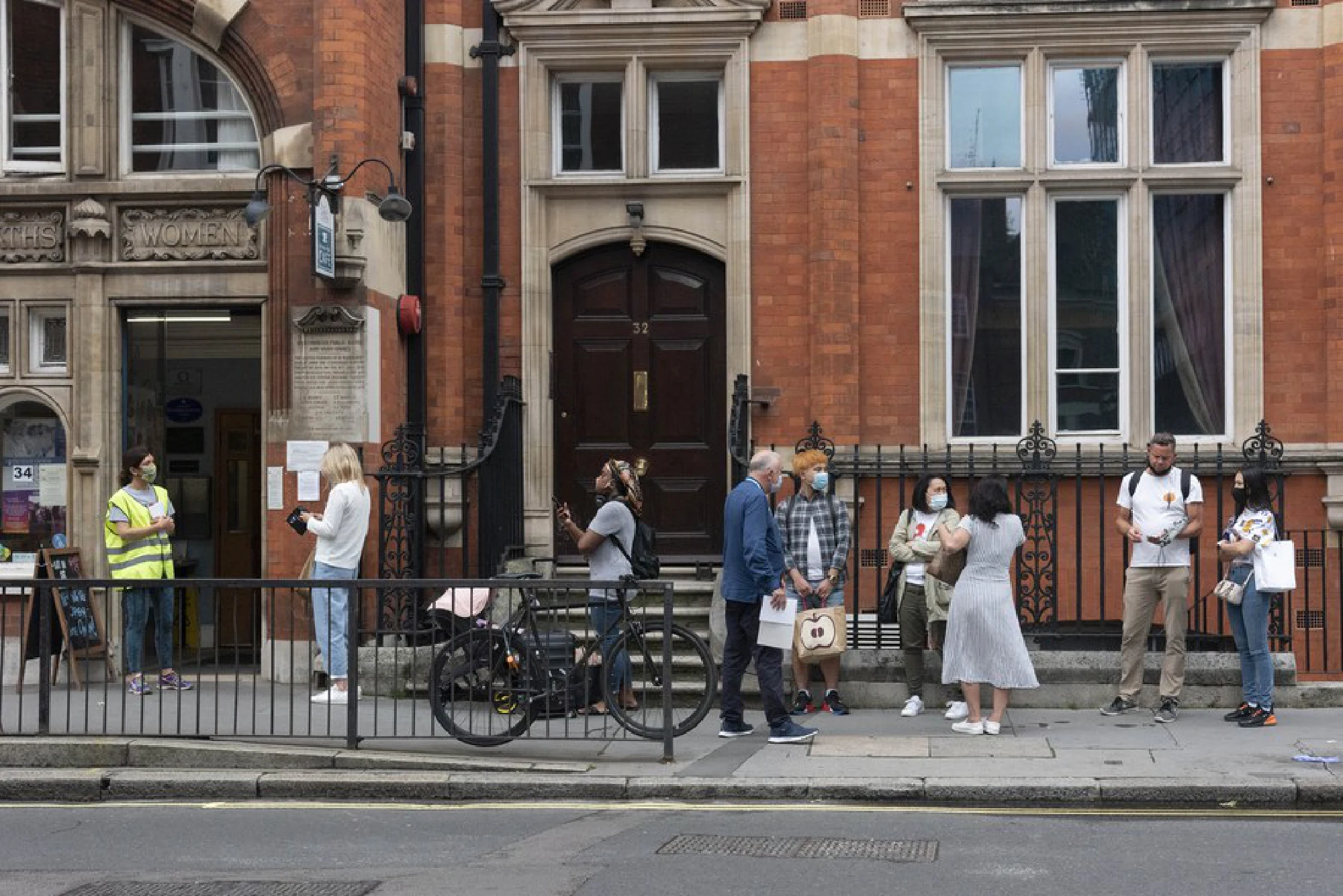 COVID vaccine walk-in centers open across England amid resurge of cases.