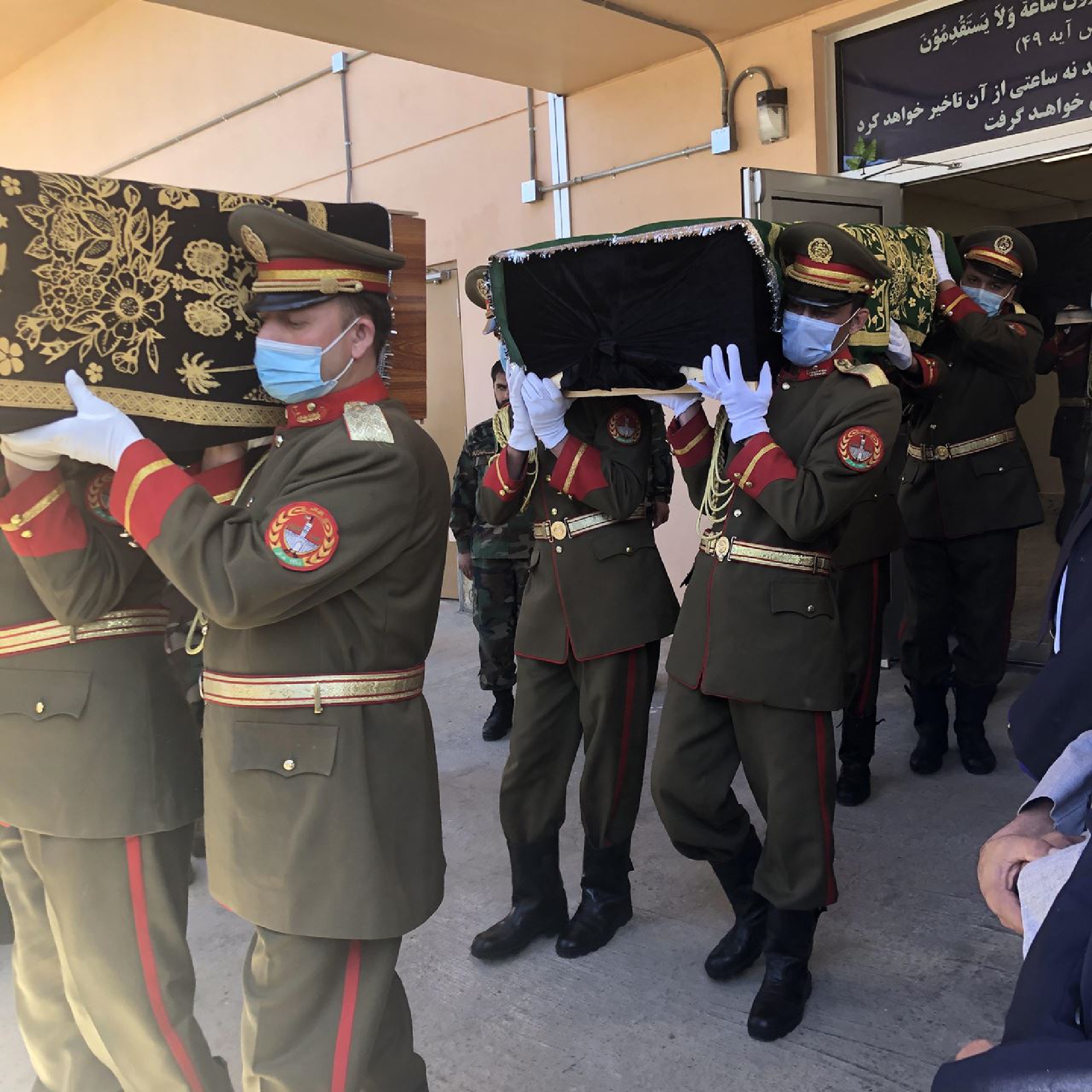 Afghan soldiers carry the coffin holding the remains of Col. Sohrab Azimi from a mourning ceremony in Kabul on June 19. MUST CREDIT: Washington Post photo by Pamela Constable.