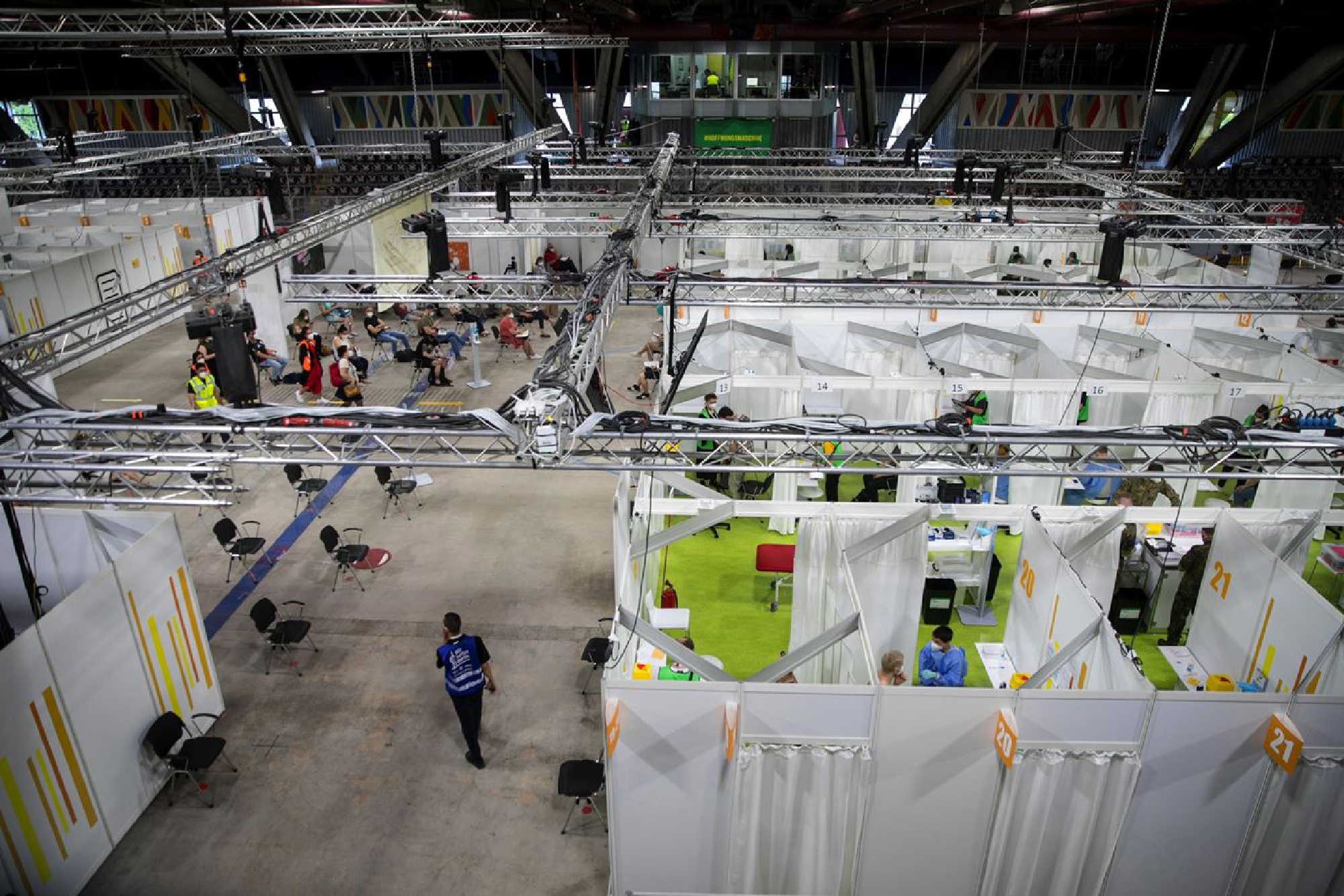 Numbered inoculation and registration booths at a covid-19 vaccination center in the Erika-Hess ice rink stadium in Berlin on June 11, 2021. MUST CREDIT: Bloomberg photo by Krisztian Bocsi