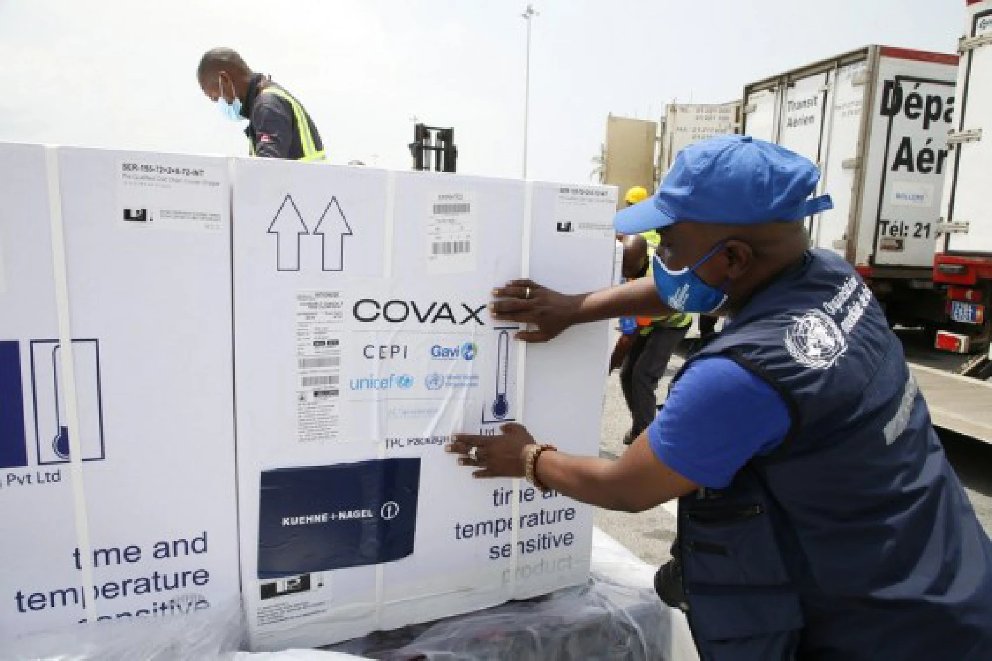 Workers transfer boxes of COVID-19 vaccines arrived at Abidjan International Airport in Abidjan, Cote d'Ivoire, Feb. 26, 2021. 