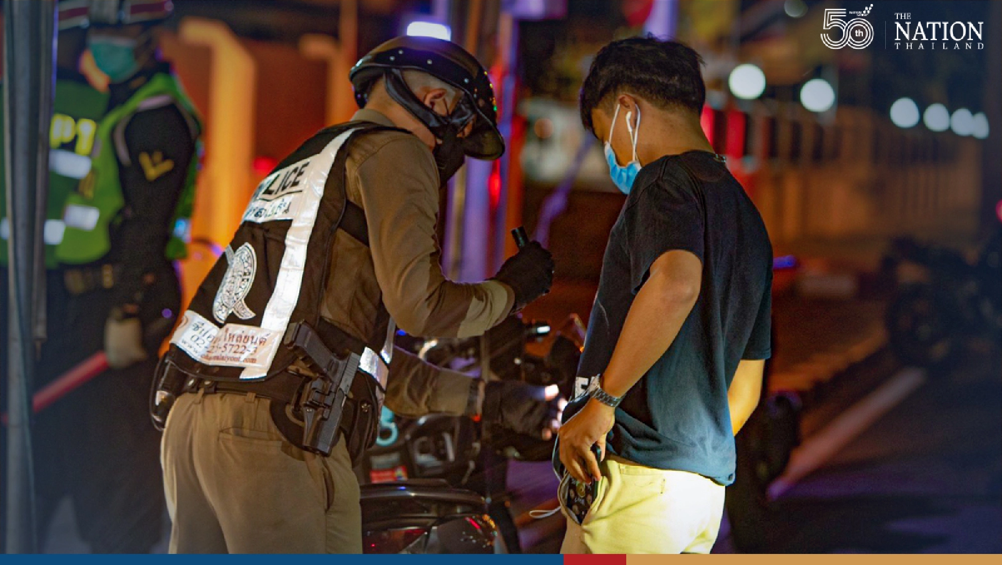 Police set up checkpoints as night curfew begins in Bangkok