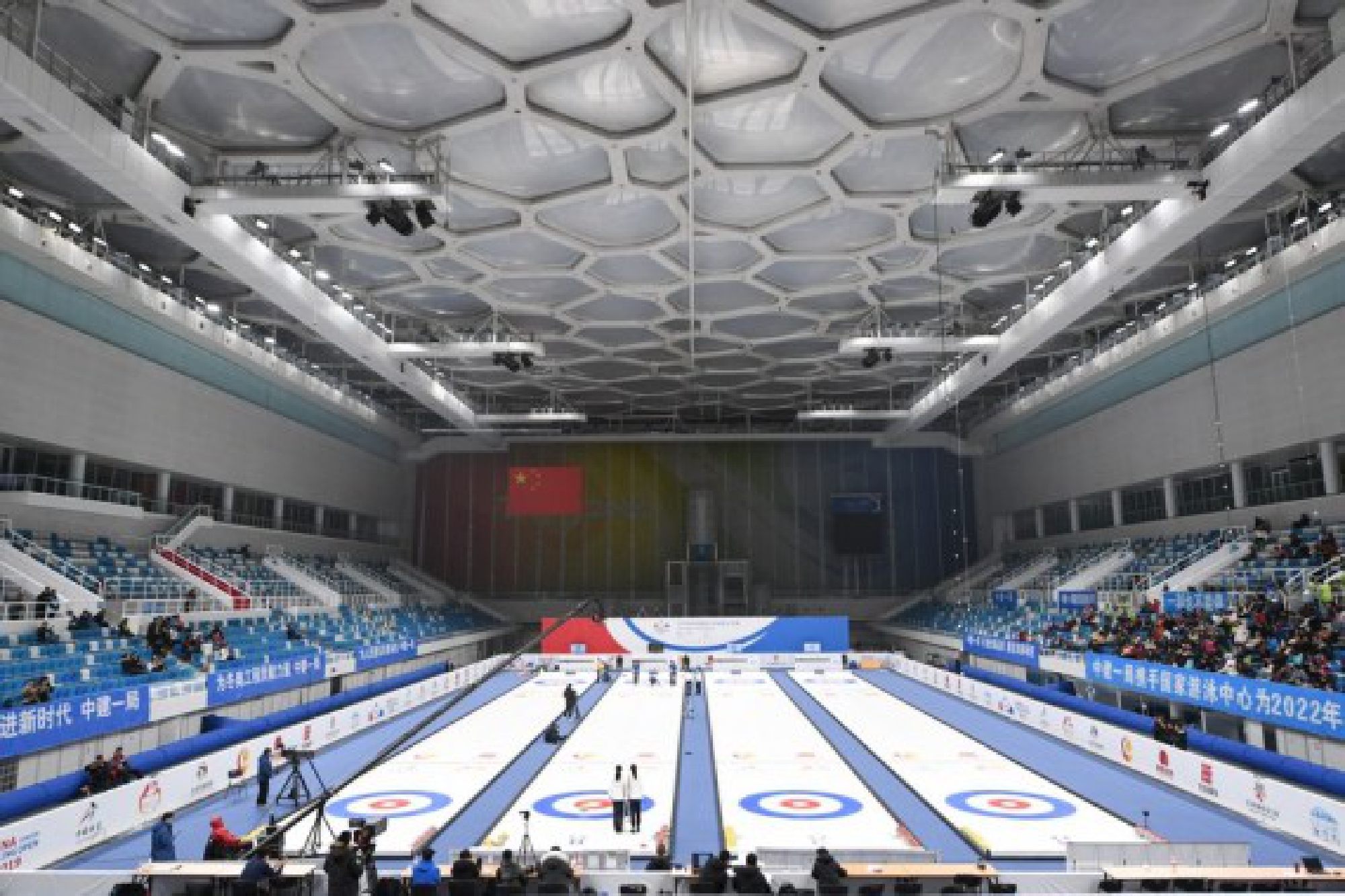 The National Aquatics Center, locally known as "Water Cube" has now transformed into the "Ice Cube" with four Winter Olympics standard curling sheets.