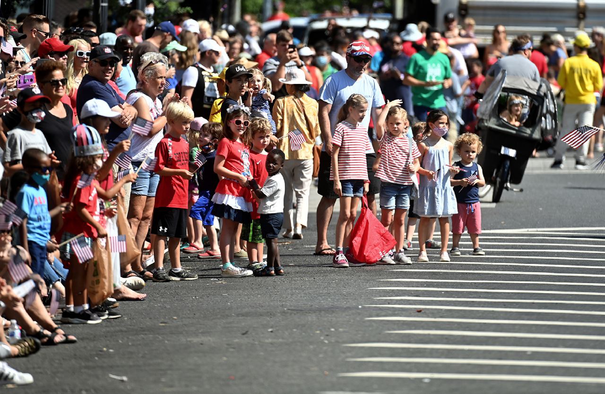 Spectators enjoy the Barracks Row Parade celebrating Independence Day in Washington, D.C., on July 4. MUST CREDIT: Washington Post photo by Marvin Joseph