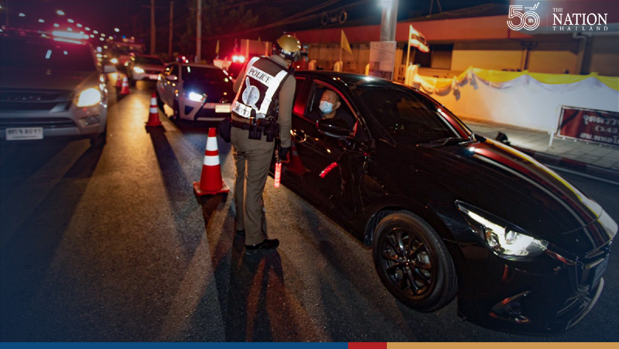 Police set up checkpoints as night curfew begins in Bangkok