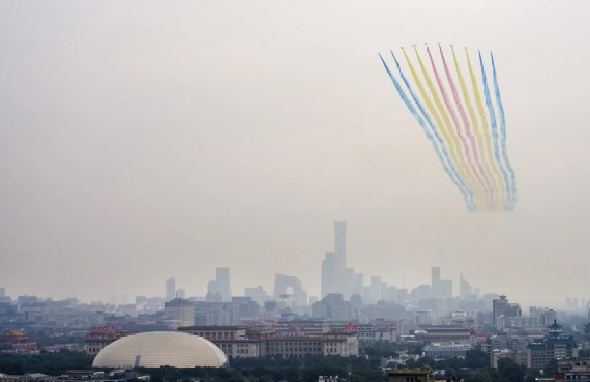 Military aircraft fly in echelon ahead of a grand gathering celebrating the Communist Party of China (CPC) centenary in Beijing, capital of China, July 1, 2021. 