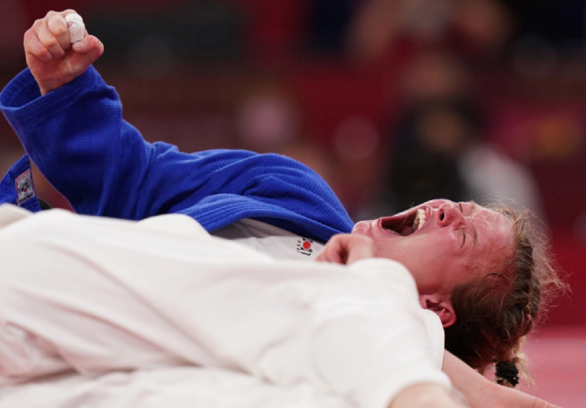 Sanne Van Dijke of the Netherlands celebrates after winning the women's -70kg bronze medal match of judo against Giovanna Scoccimarro of Germany at Tokyo 2020 Olympic Games in Tokyo, Japan, July 28, 2021.
