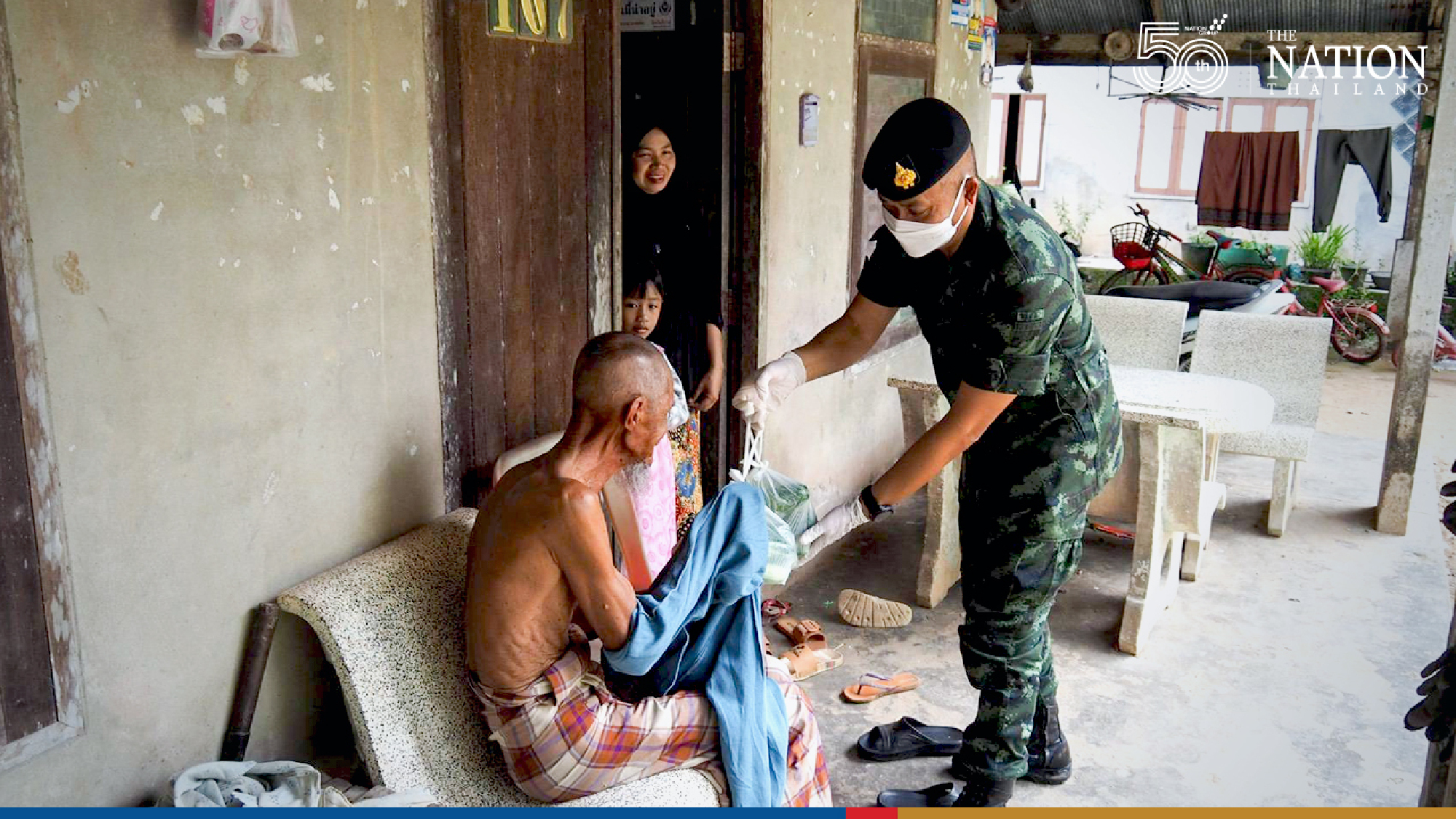 ‘Caring’ soldiers troop into Narathiwat community to hand out vegetables
