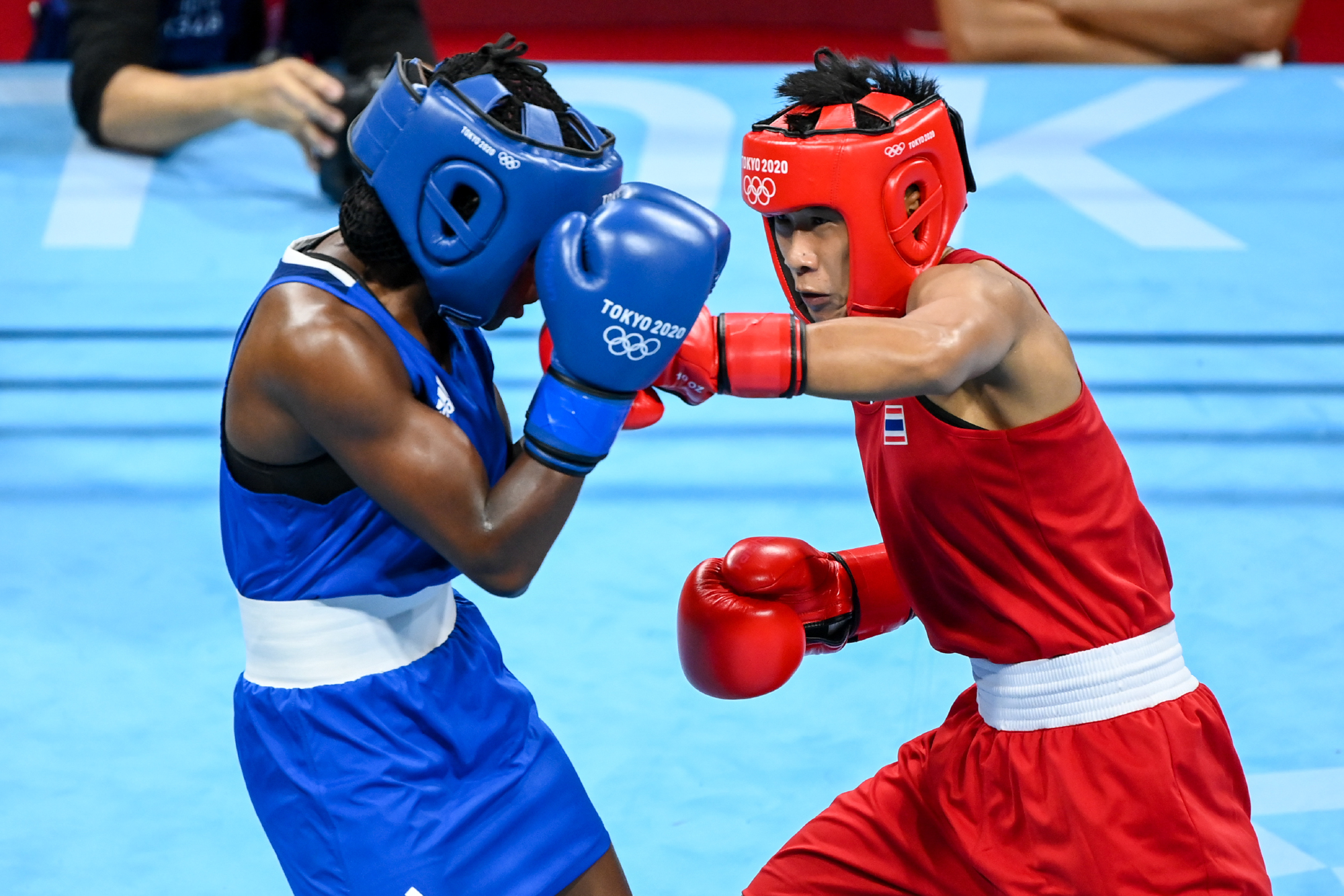 Sudaporn dominates 1st opponent to join 2 other Thai boxers in medal quest.