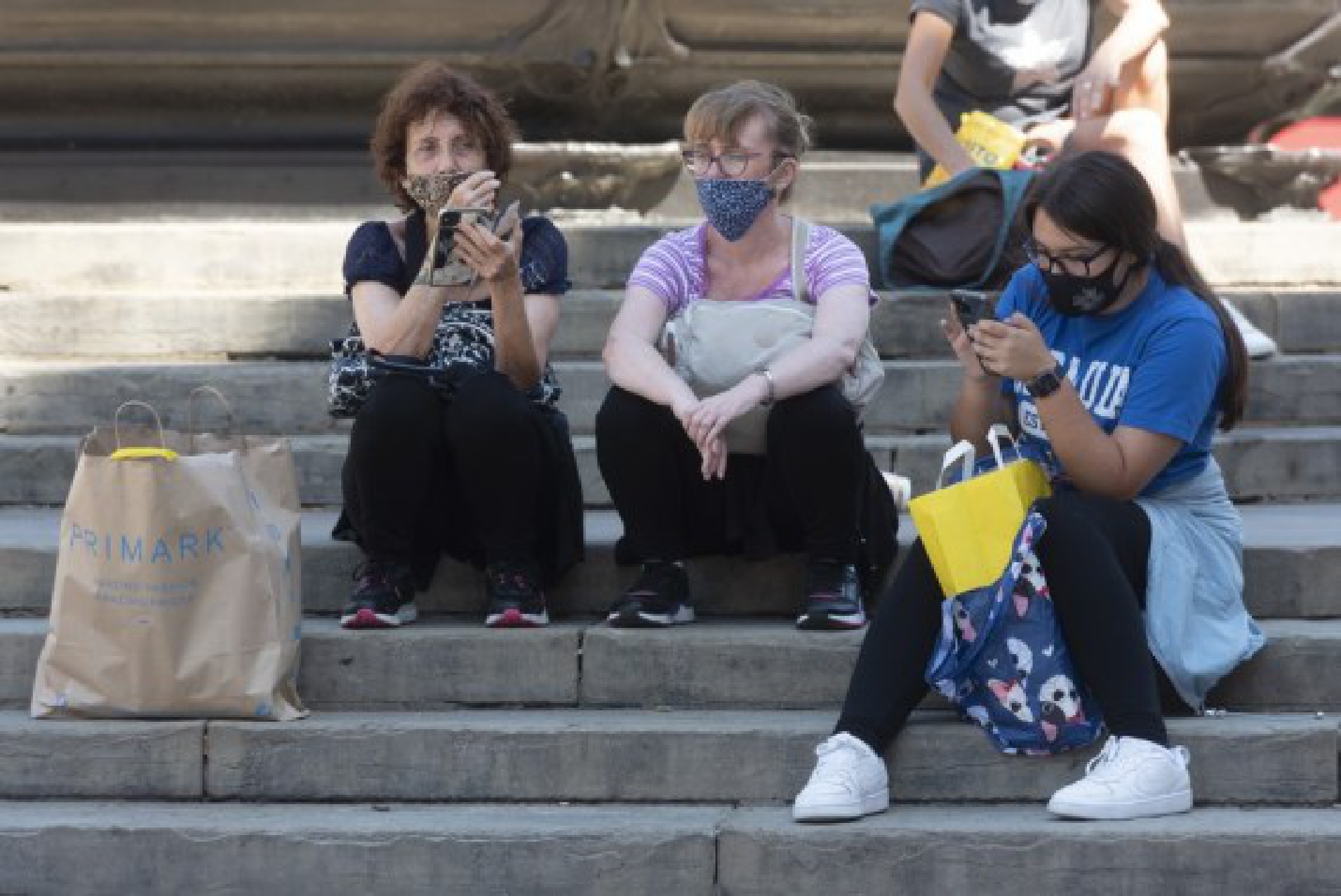  People wearing face masks are seen at Piccadilly Circus in London, Britain