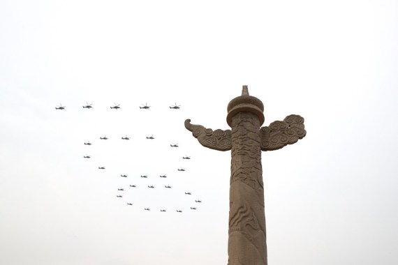 Helicopters fly over Tian'anmen Square in the formation of "100" ahead of a grand gathering celebrating the Communist Party of China (CPC) centenary at Tian'anmen Square in Beijing, capital of China, July 1, 2021.