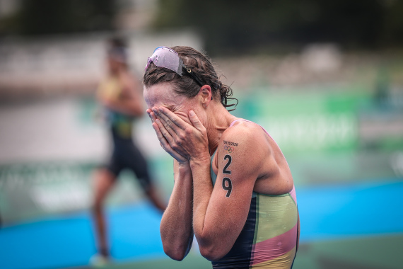 Flora Duffy of Bermuda sheds tears after winning Tokyo 2020 women's individual final of triathlon in Tokyo, Japan, July 27, 2021.