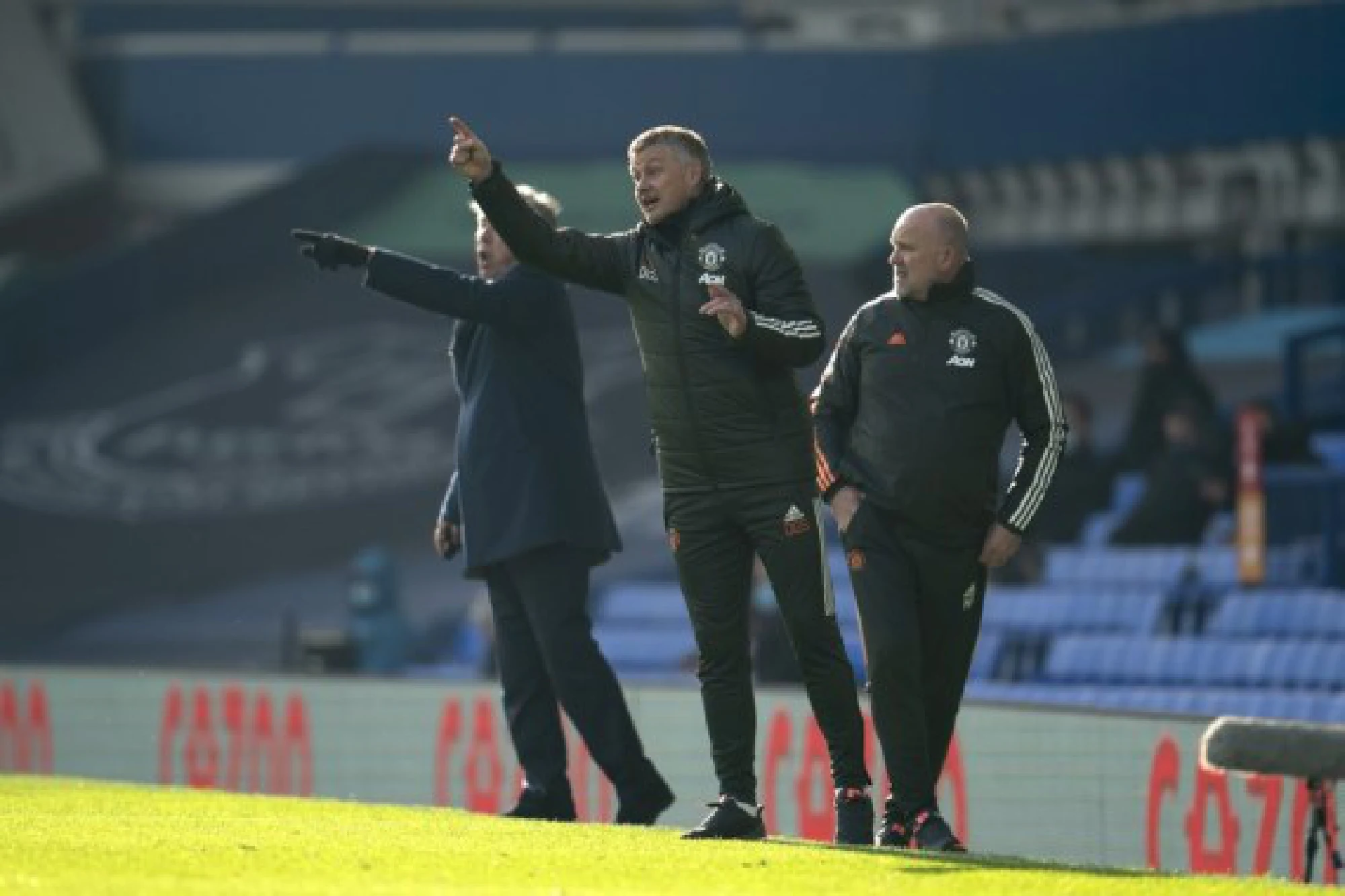 Manchester United's manager Ole Gunnar Solskjaer (C) makes his instructions from the touchline during the Premier League match against Everton at Goodison Park Stadium in Liverpool