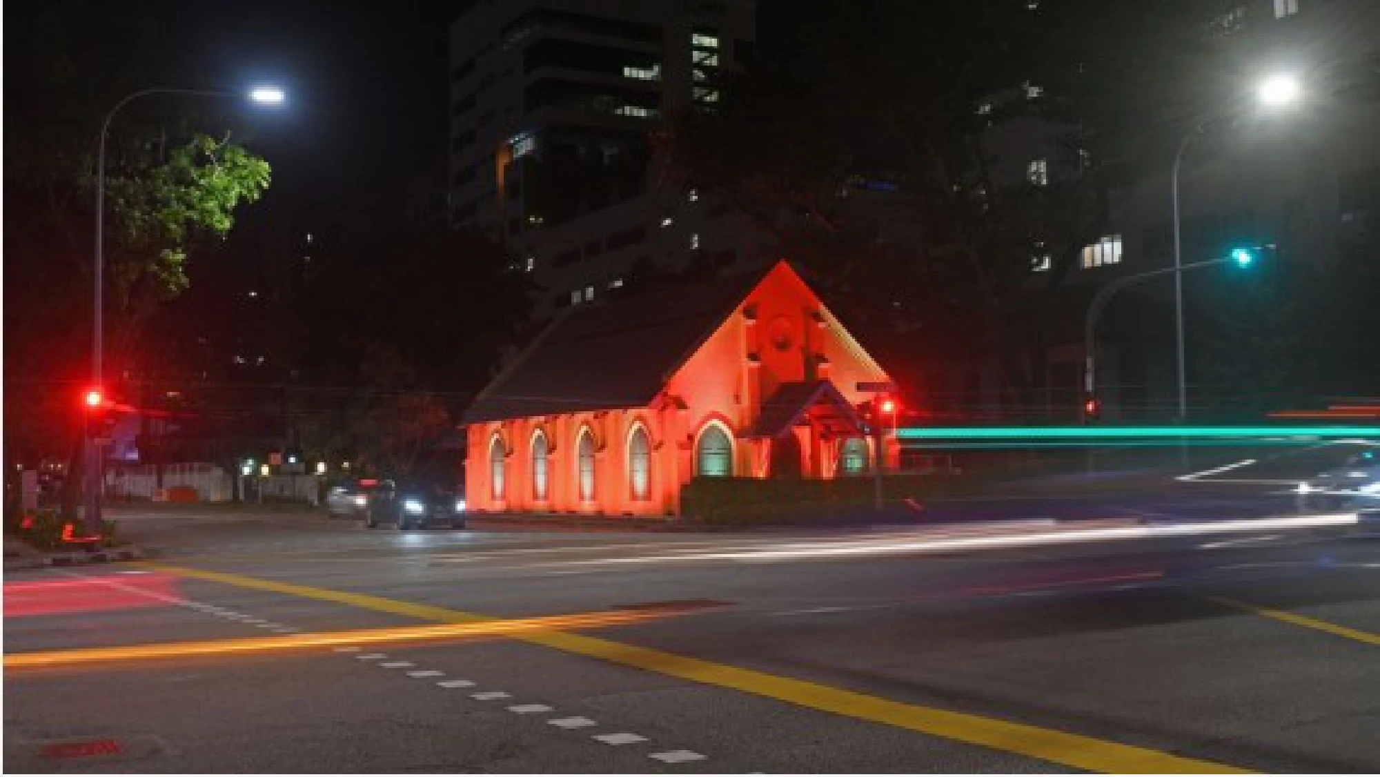 Photo taken on Aug. 10, 2021 shows light projections on the facade of Objectifs, a center for photography and film arts in Singapore, in celebration of the country's 56th anniversary of independence. 