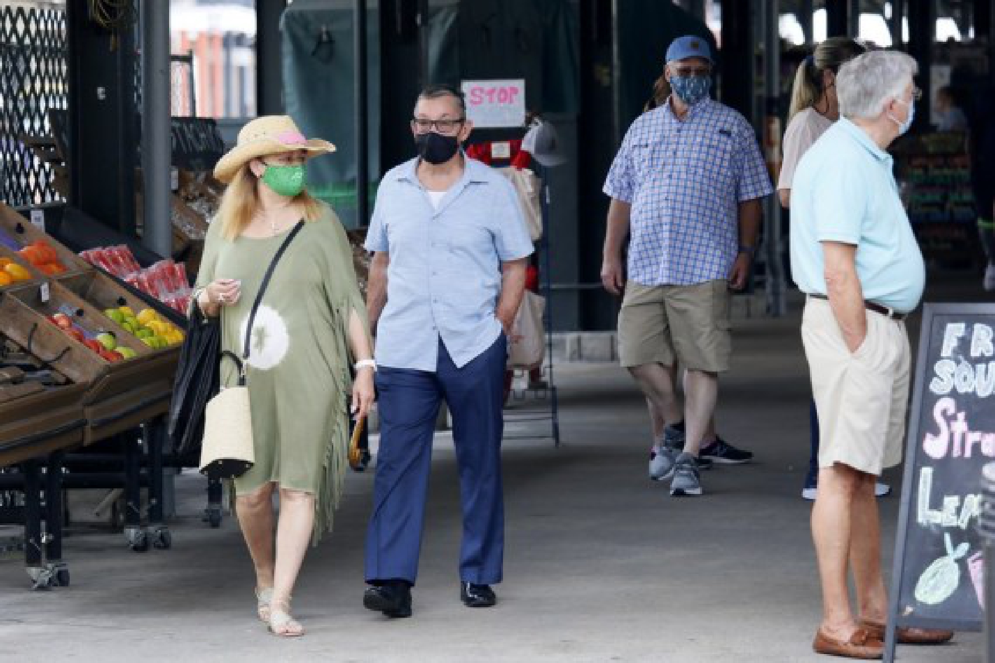 People wearing face masks visit a market in New Orleans, Louisiana, the United States, on Aug. 3, 2021.
