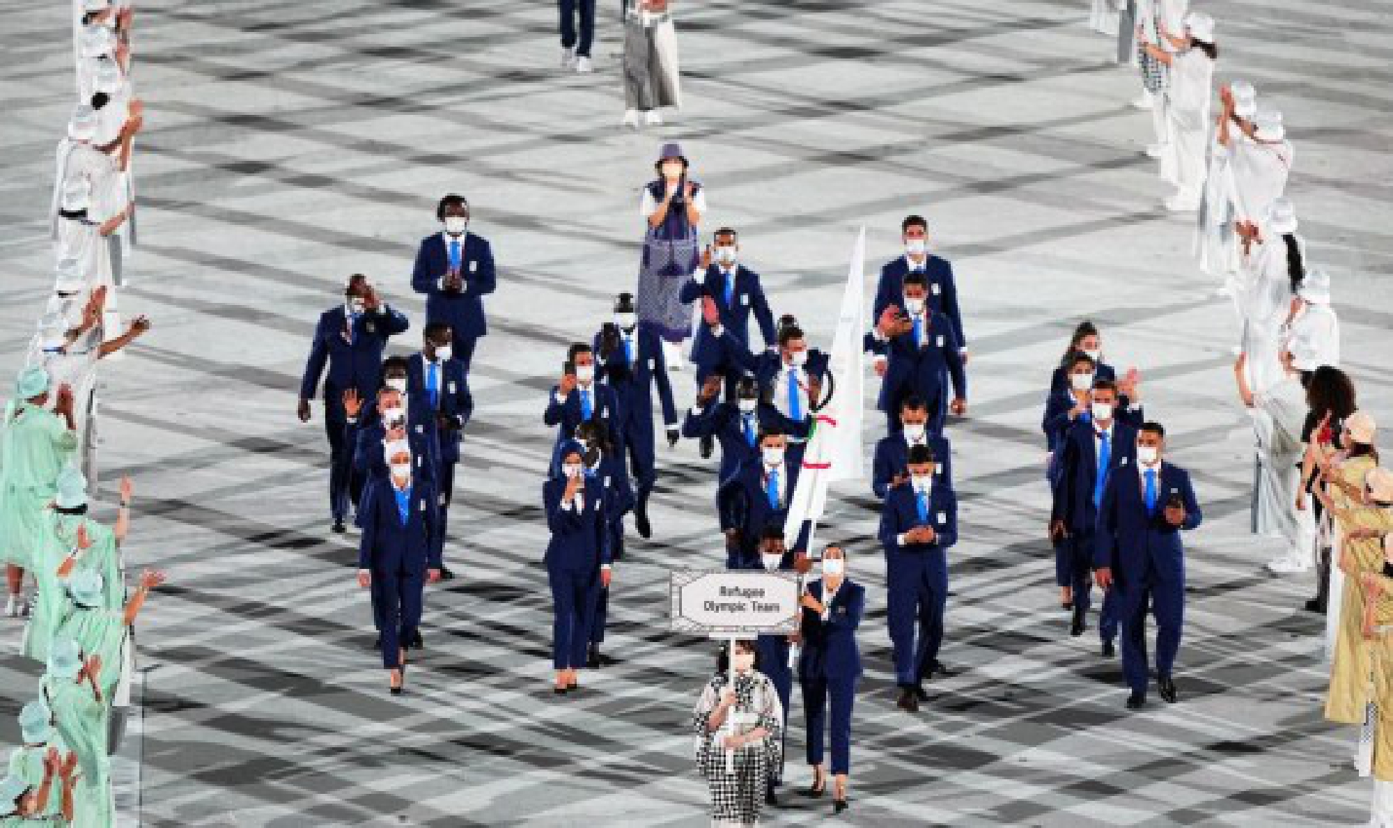 Delegation of Refugee Olympic Team parade into the Olympic Stadium during the opening ceremony of Tokyo 2020 Olympic Games in Tokyo, Japan, July 23, 2021.